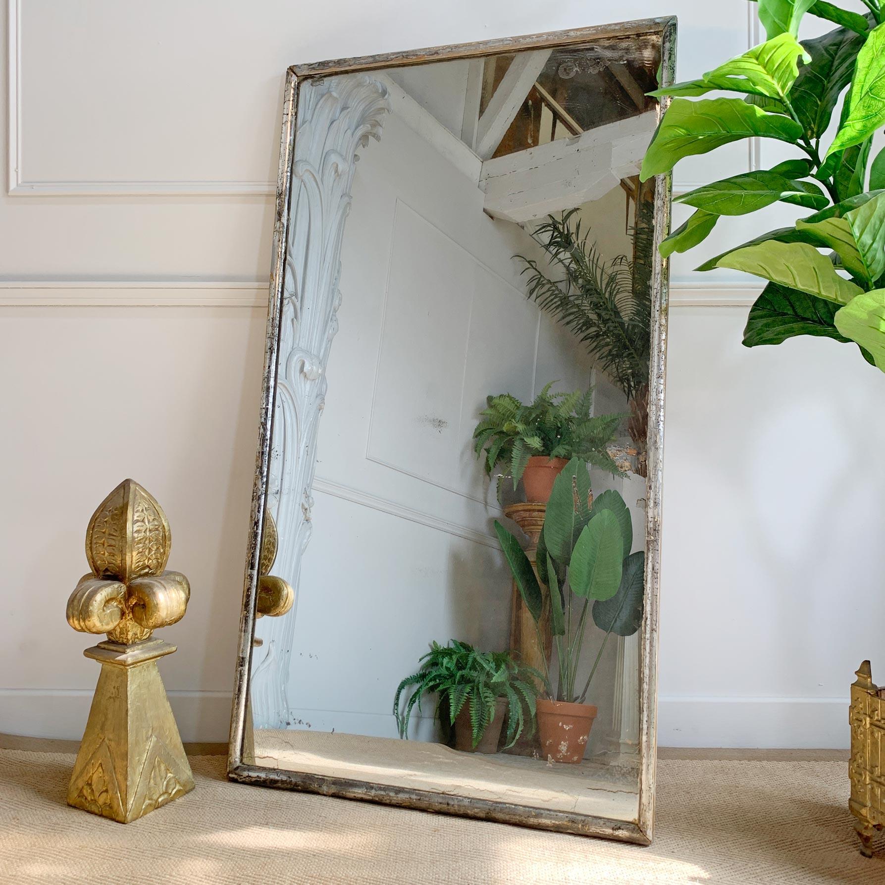 A remarkable 19th century silver gilt narrow framed rectangular mirror, original foxed mercury plate with the most incredible glittering. Wear to the frame commensurate with age, the simplistic nature of the frame coupled with the silver gilding and