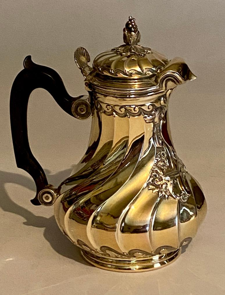 French silver-gilt hot milk jug, with carved wood handle.