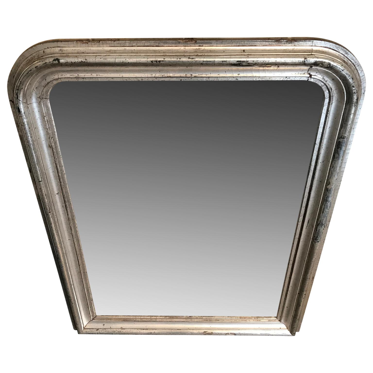 Large Louis Philippe silver gilt mantel or fireplace mirror, with the original split mirror.



 