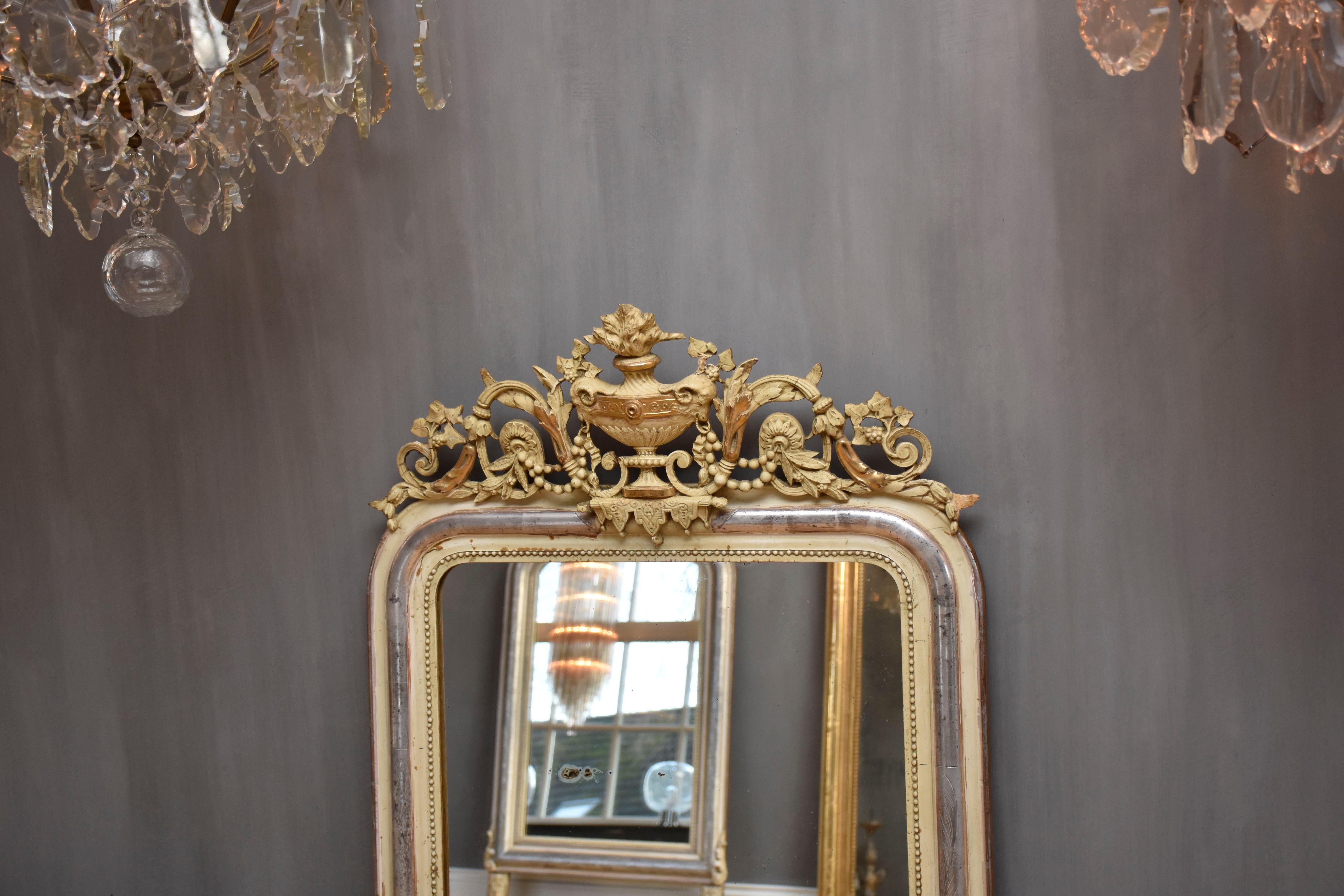 Louis Philippe 19th century silver leaf gilt French mirror with a crest For Sale
