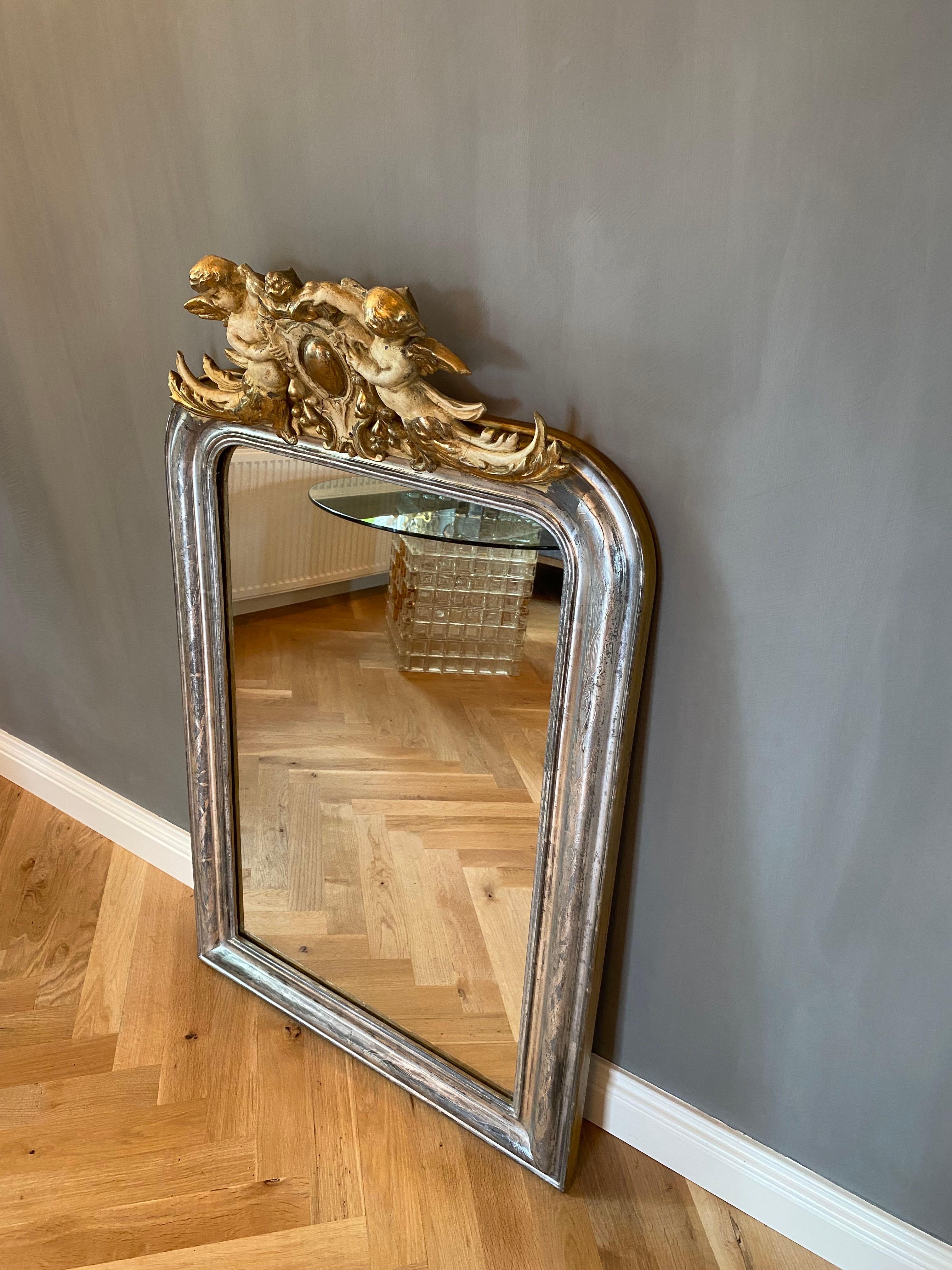19th century silver leaf gilt French mirror with a crest with putti 4