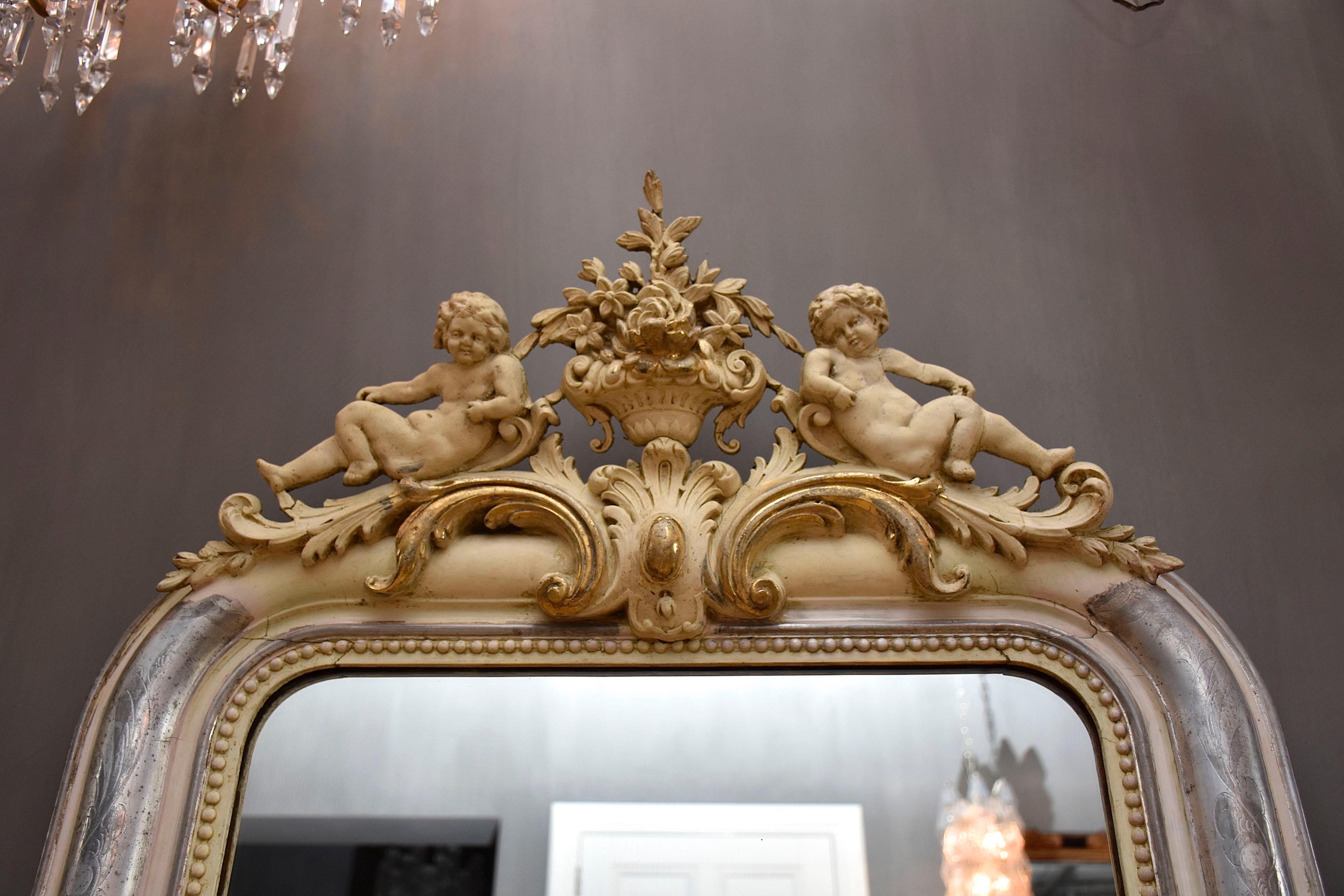 19th Century 19th century silver leaf gilt mirror Louis Philipe with putti For Sale