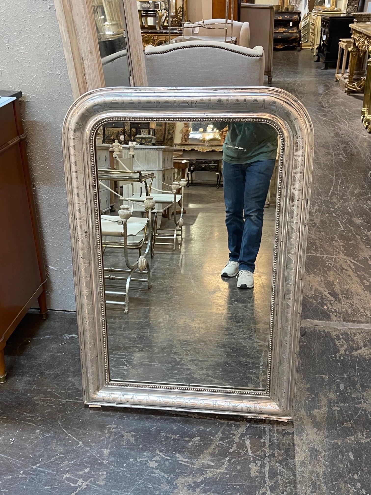 Beautiful 19th century silver leaf Louis Philippe mirror with interesting zig zag pattern. There is also a beaded inner border. Very pretty!!
