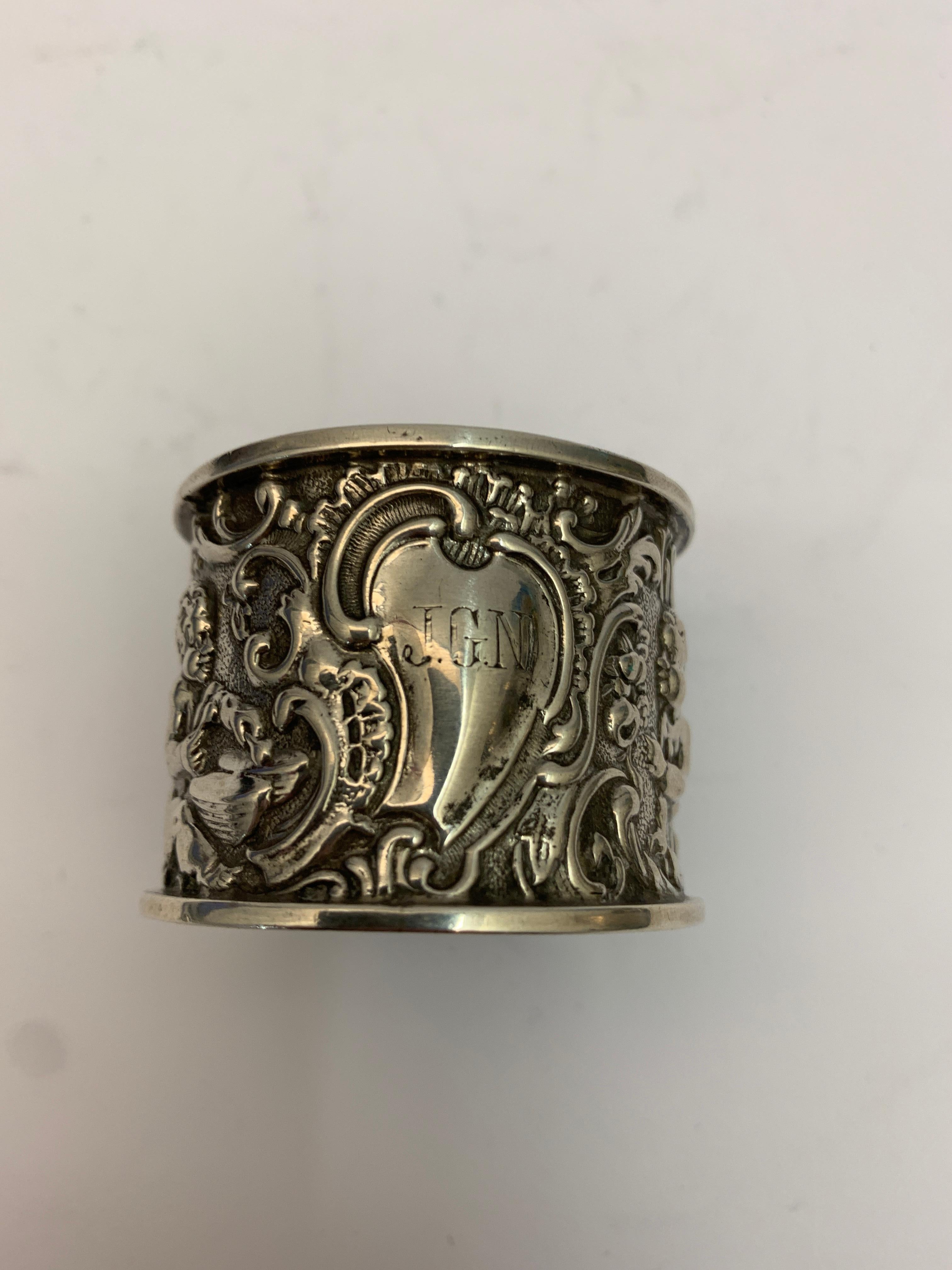 A single intricately decorated 19th century silver napkin ring.

Made in Birmingham in 1895.