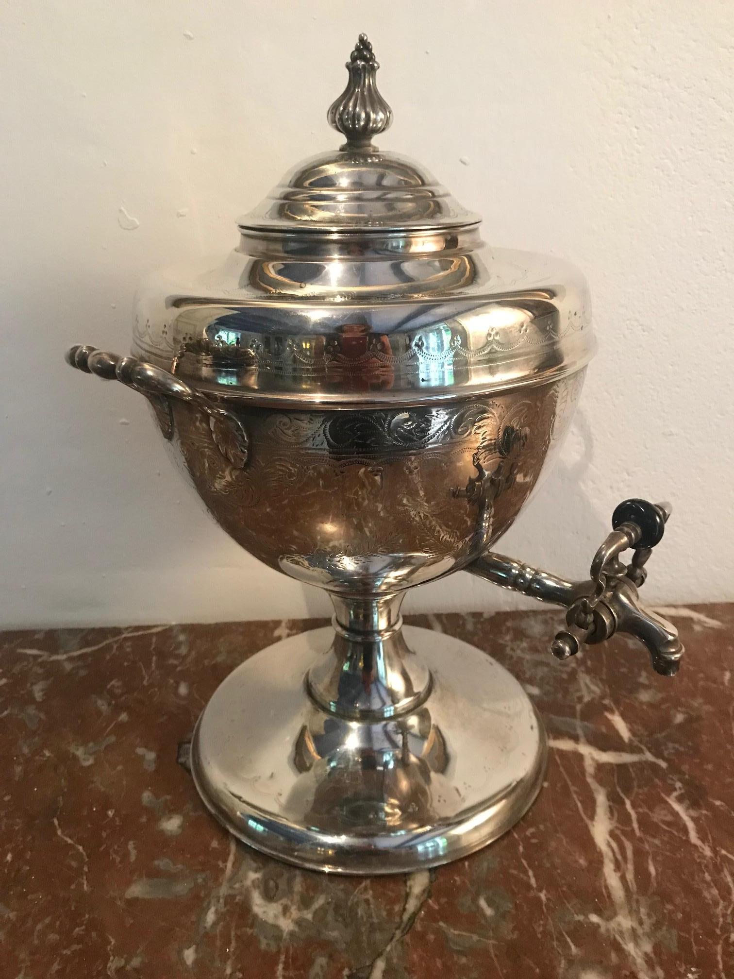 A 19th century elegant silver plate tea urn/ samovar with delicate floral engraving.
