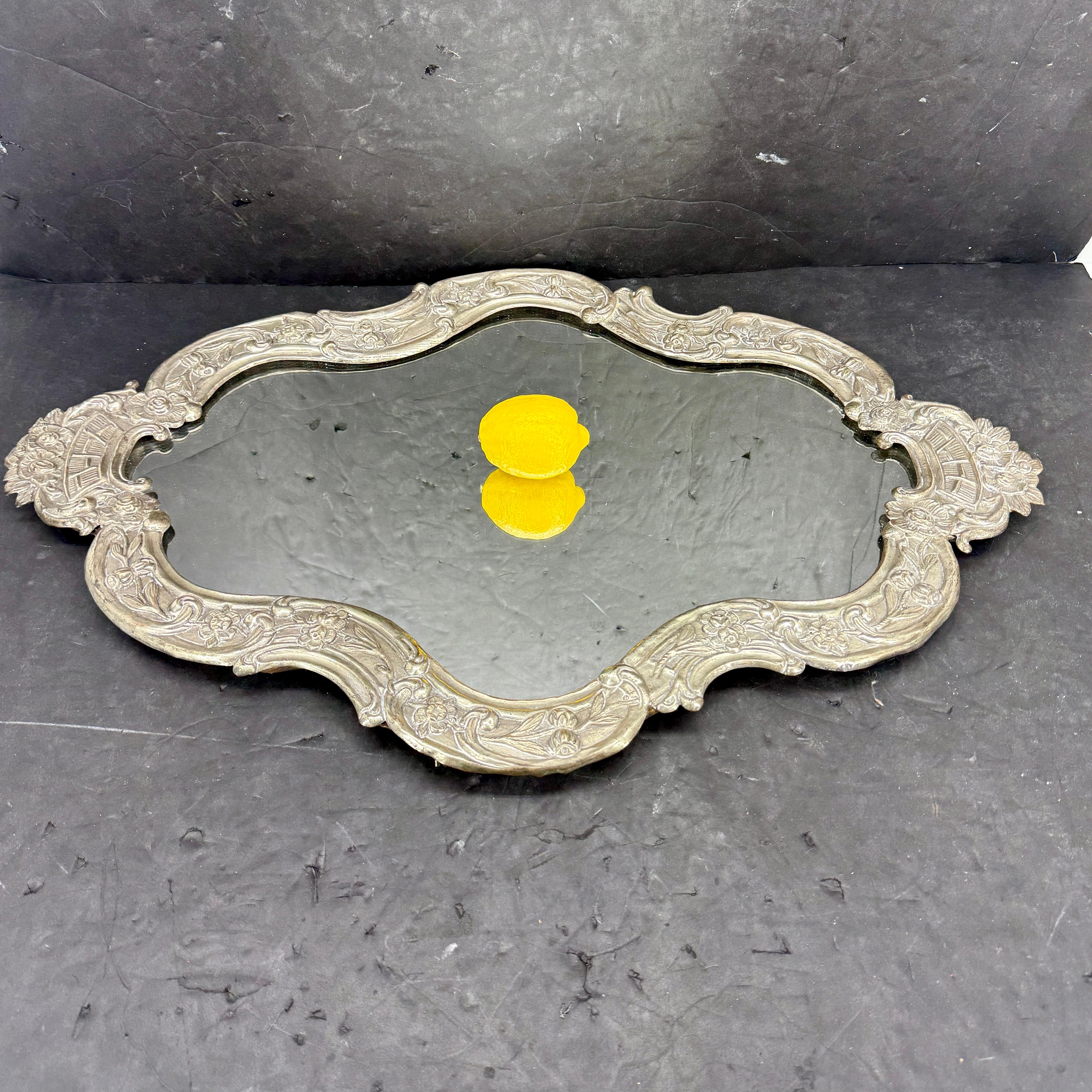 Mirrored Oversized Tabletop Tray from the Early to Mid-19th Century. The European ornate silver plate tray is a very versatile accessory, with lots of functionality, including sitting on a dining or hall table.. This decorative tray would also be