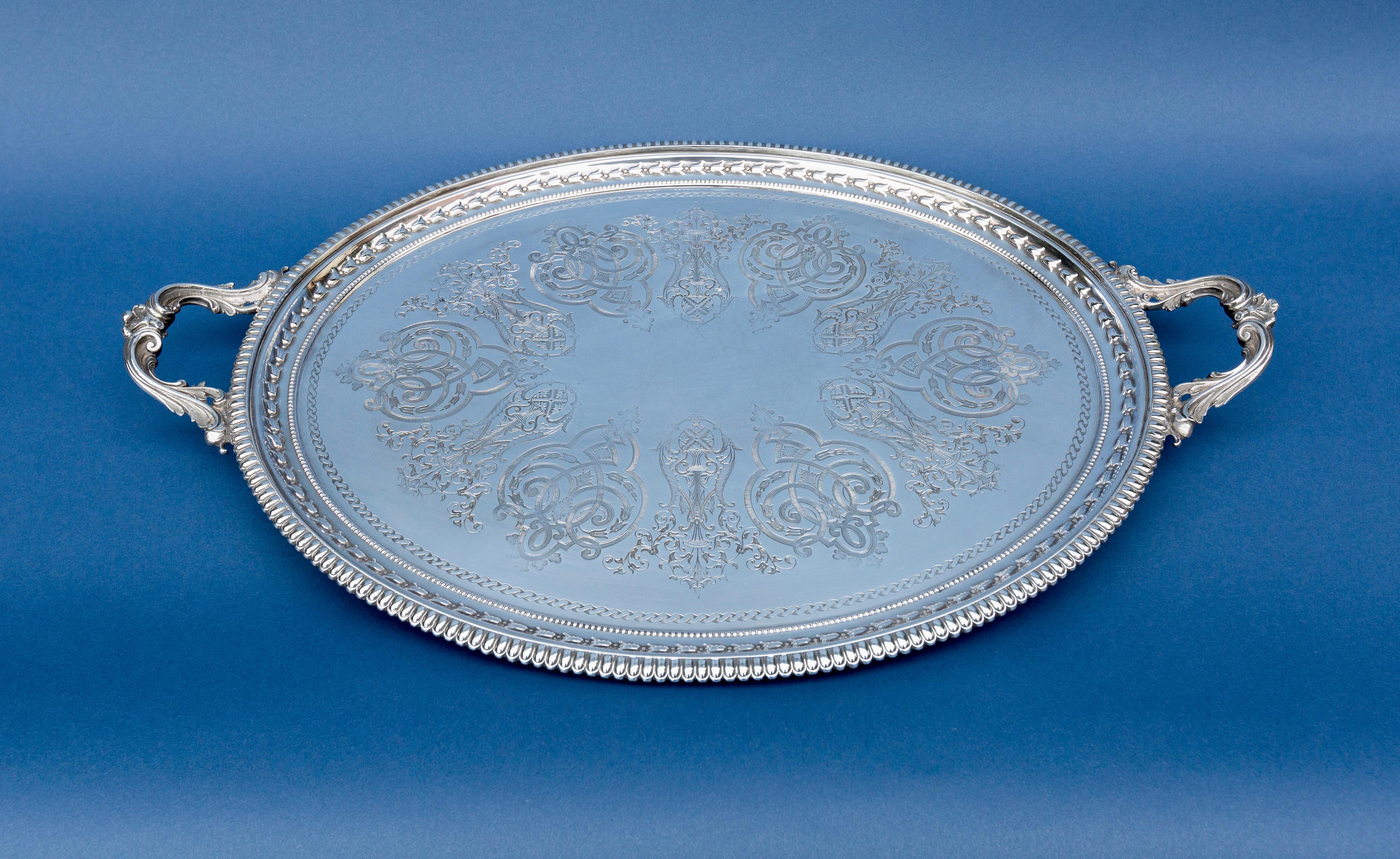Martin Hall & Co:, large silver plated oval tray, on four shallow feet and with curved bracket handles.