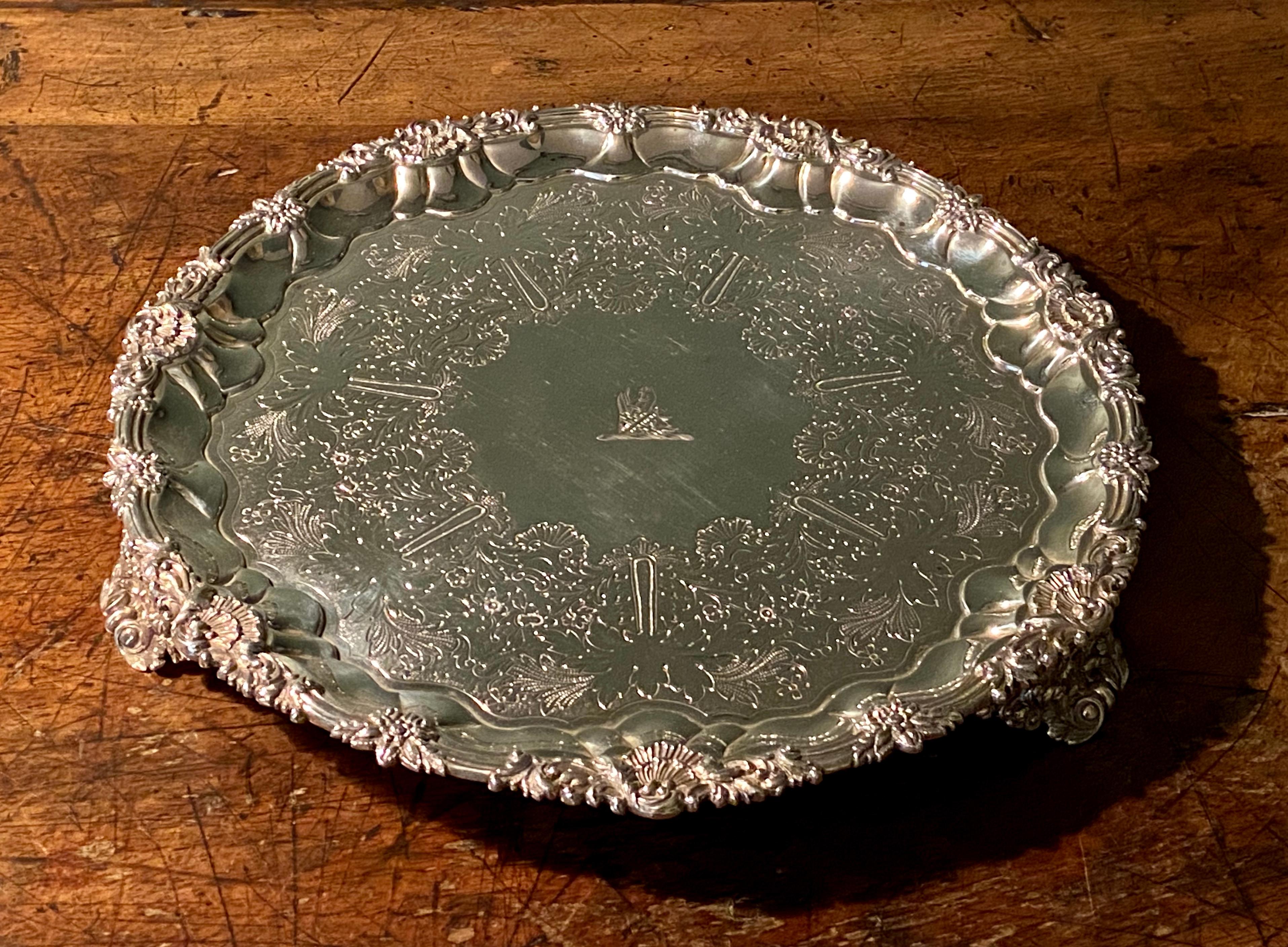 George IV silver salver on three cast shell feet, engraved with a crest, by William Bateman, London, 1829.