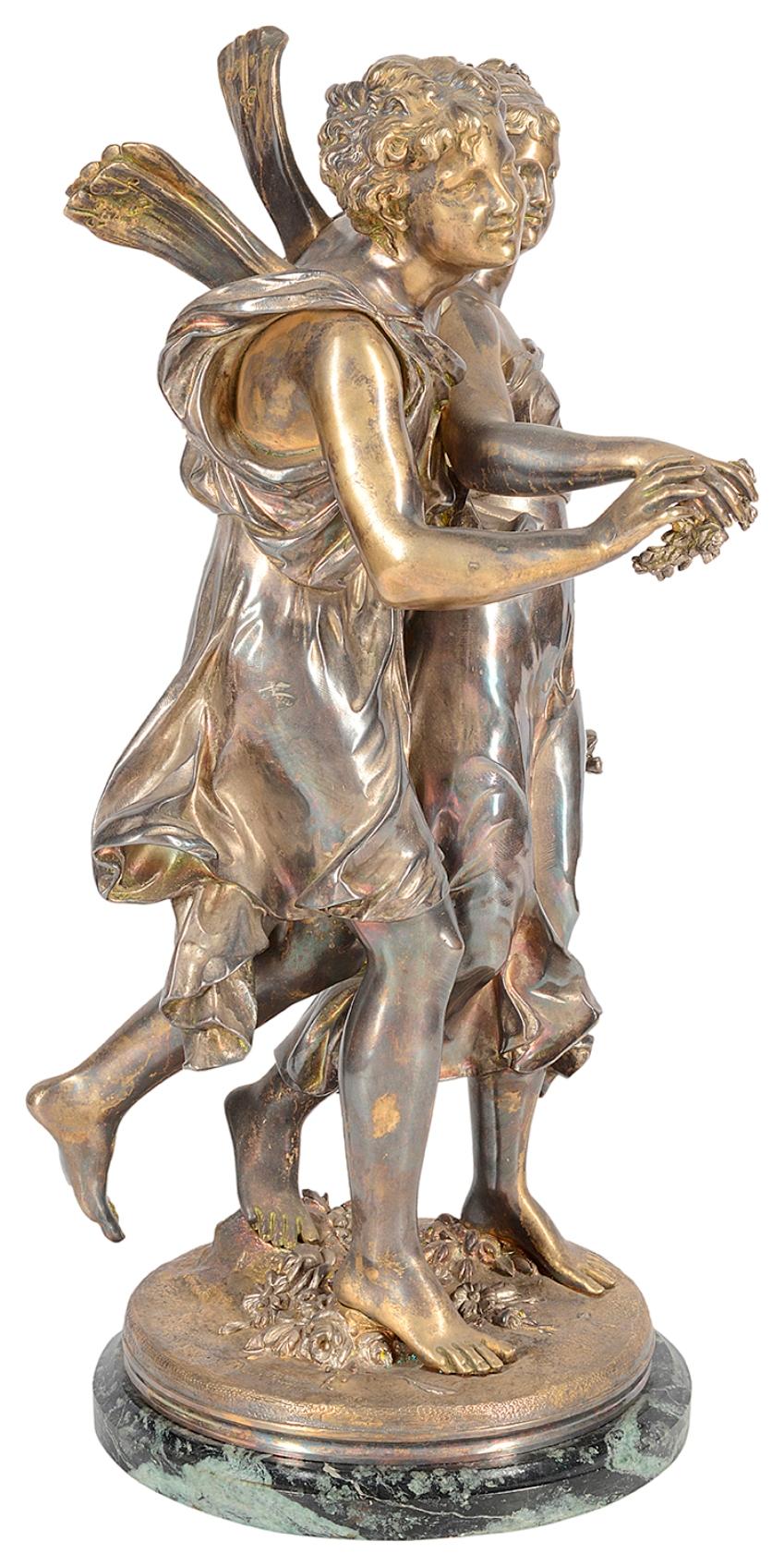 A very good quality 19th century silvered bronze statue of a winged cherub escorting a young maiden holding flowers, raised on a green marble base.
Signed 'Dumaige'
Henry Étienne Dumaige (1830-1888).