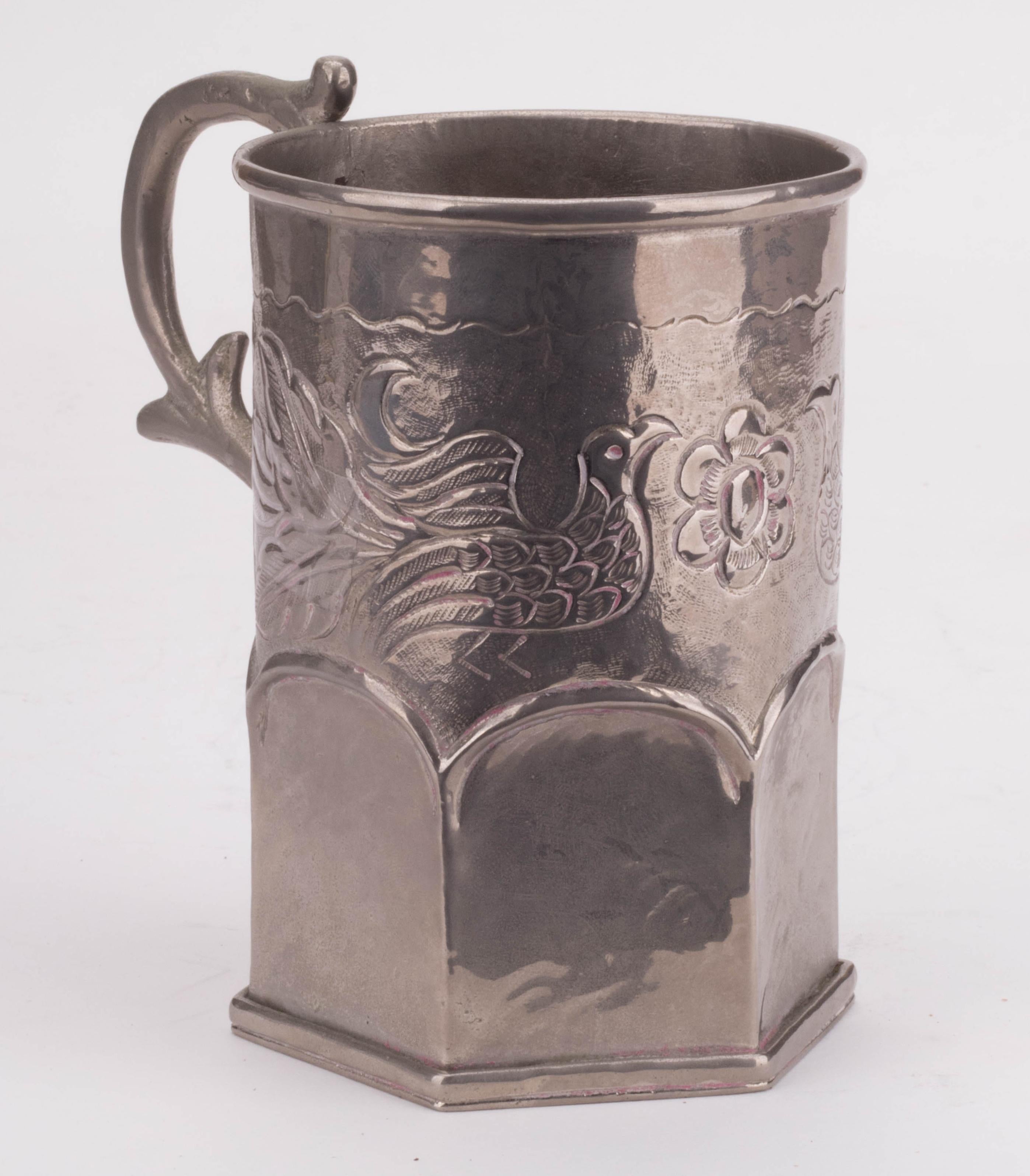 19th century silvered metal jug with floral engravings. 

Weight: 303g.