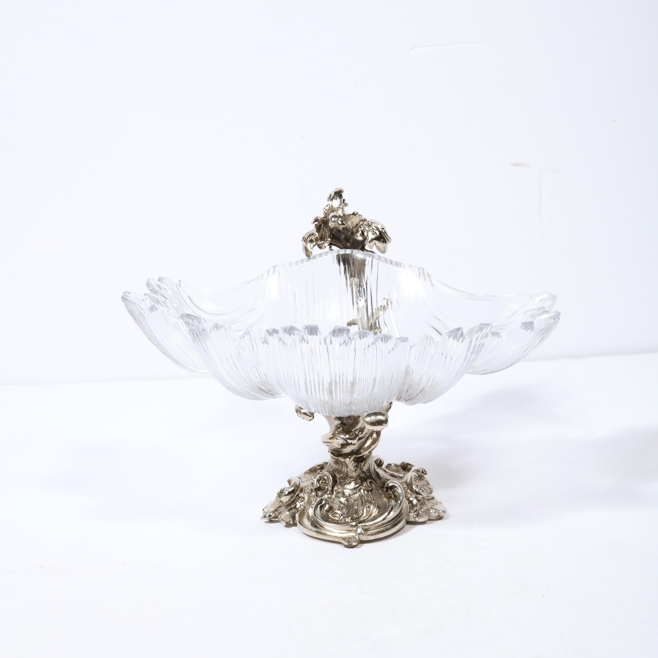 This elegant stylized shell bowl was realized by the illustrious atelier of Les Freres in France during the 19th century. It offers a stylized silvered ormolu footed base with abstract swirling forms suggestive of troubled sea waters and waves