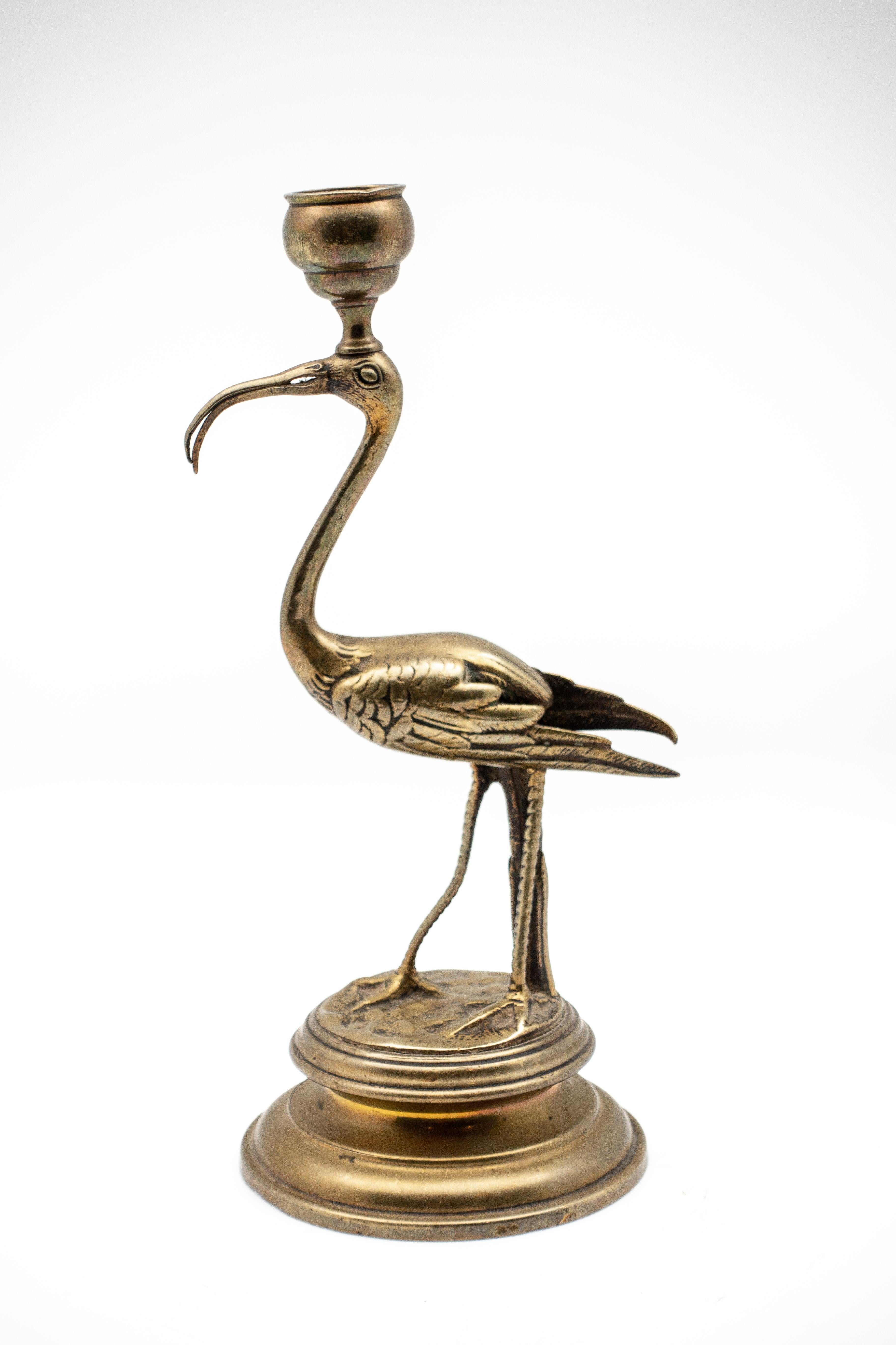 Beautifully intricate single candle holder of a 19th century bronze Ibis on a round plinth.