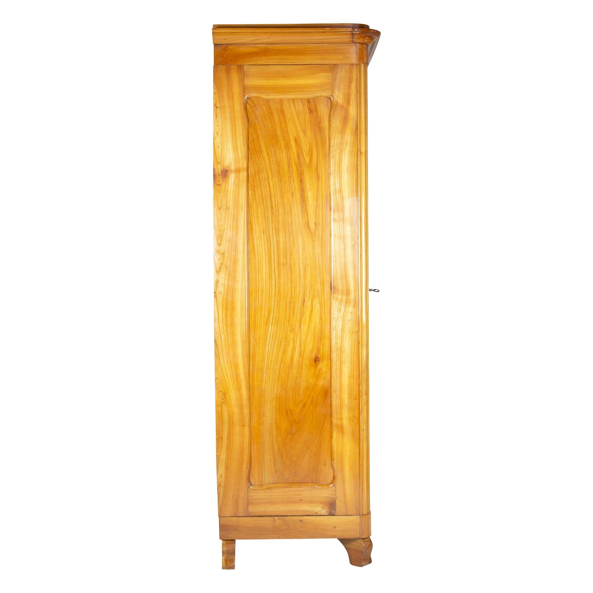 Beautiful wardrobe from the time of the Biedermeier circa 1850. Made of solid cherrywood. The wardrobe was lovingly restored by us. The wardrobe can be dismantled and shipped dismantled. The backside, bottom and top are made of spruce wood as usual.