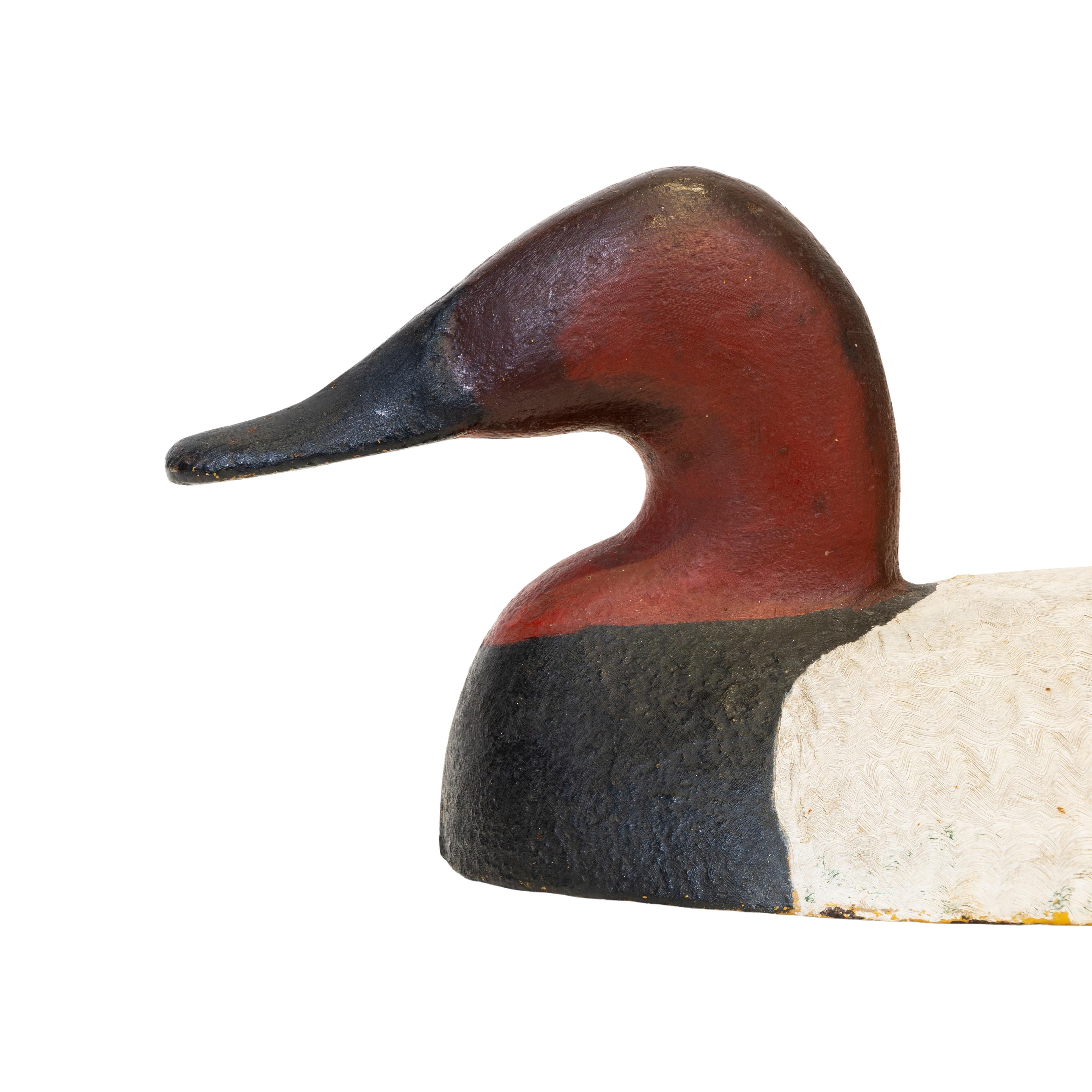 Pair of canvas back sink box canvasback decoys used by a market hunter on Long Island. Original paint. Over 20 pounds each.

Period: Last quarter 19th century

Origin: Sanders Foundry, NC

Size: 15