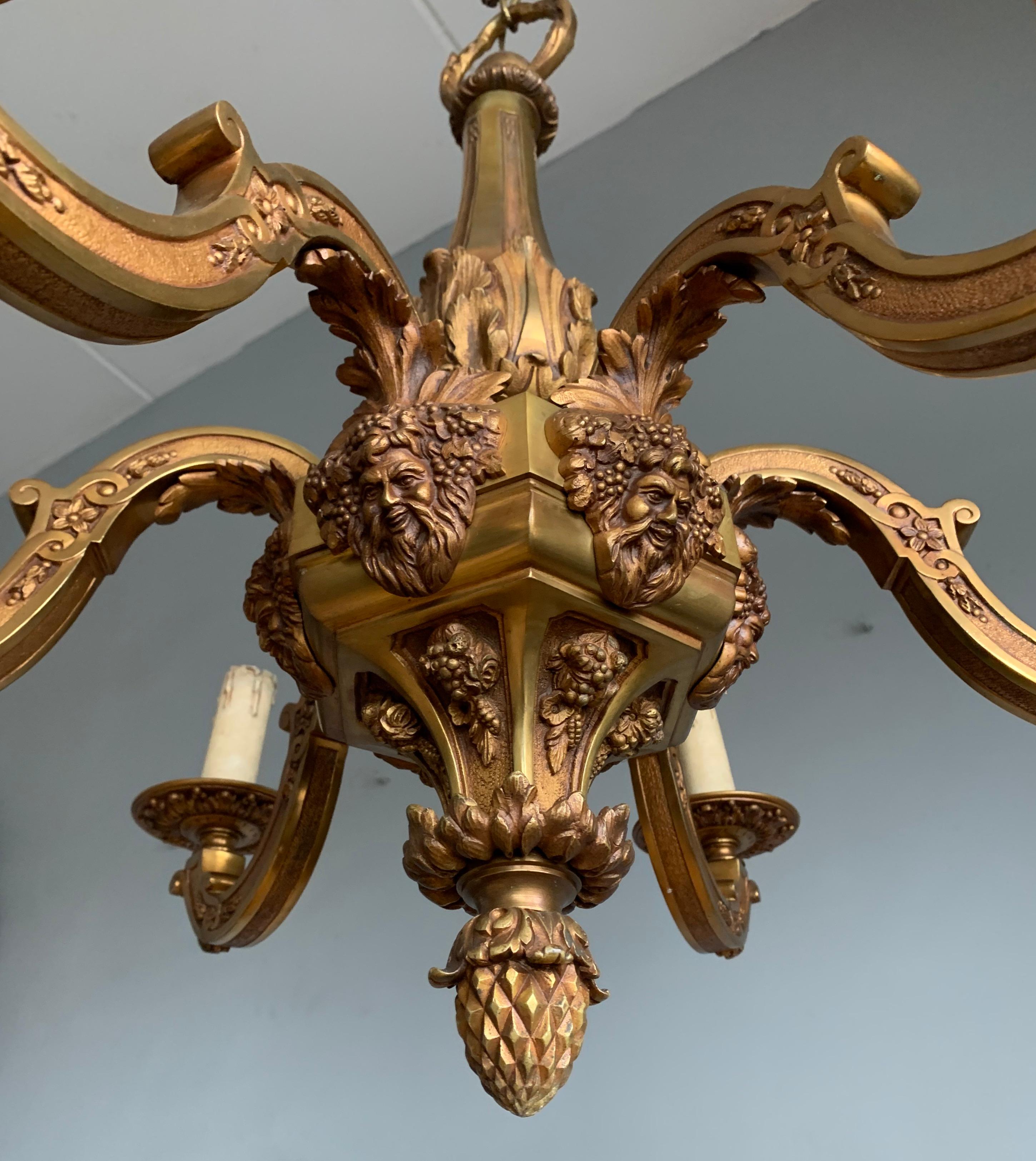 Beautiful quality, turn of the century craftsmanship pendant light.

This stunning bronze chandelier of practical size is in excellent condition. The top quality workmanship is unlike anything that you can find in stores in this day and age, but