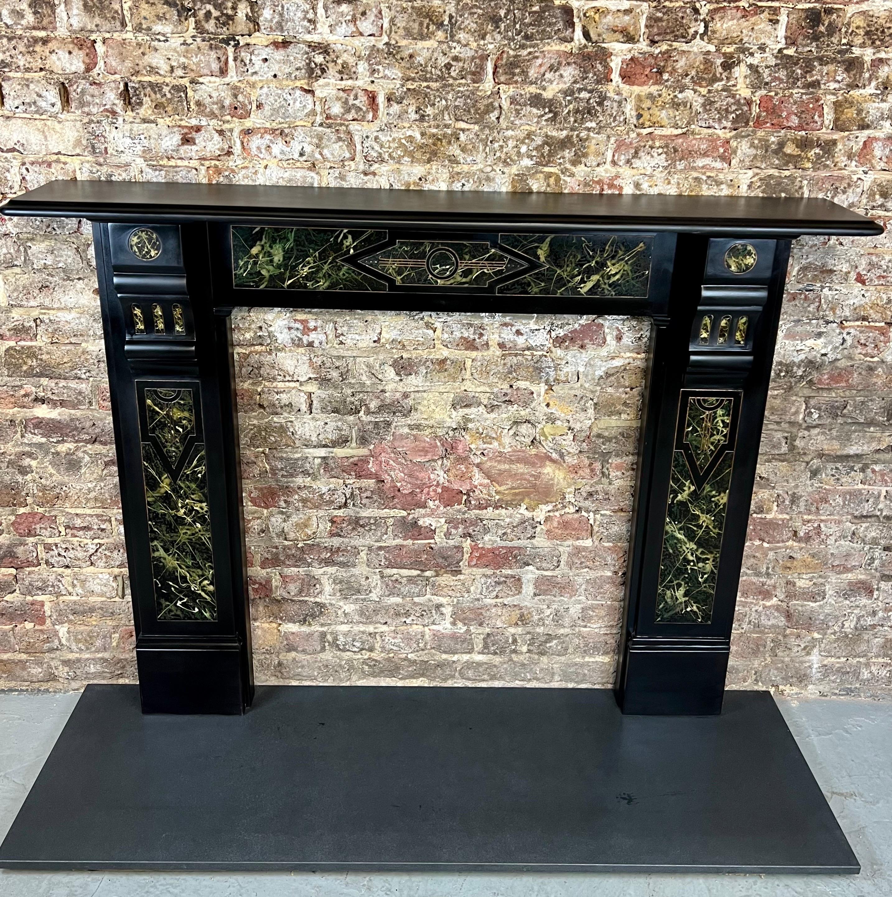 This 19th Century slate & marbleized fireplace mantlepiece is a true example of English Victoriana, demonstrating the new techniques used for the fashion of the period. This antique fireplace surround is made from fine Welsh slate, blackened finish
