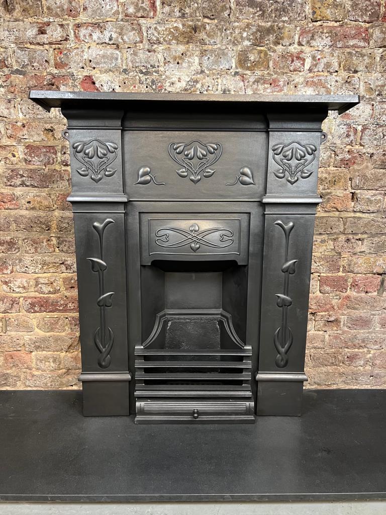 20th Century Small Art Nouveau Style Cast Iron Fireplace Combination.
This  Fireplace Has Been Recently Salvaged From A London Period Town House.
This Is In Good Condition With Original Back & Front Bars.
This Size Would Typically Be Featured In