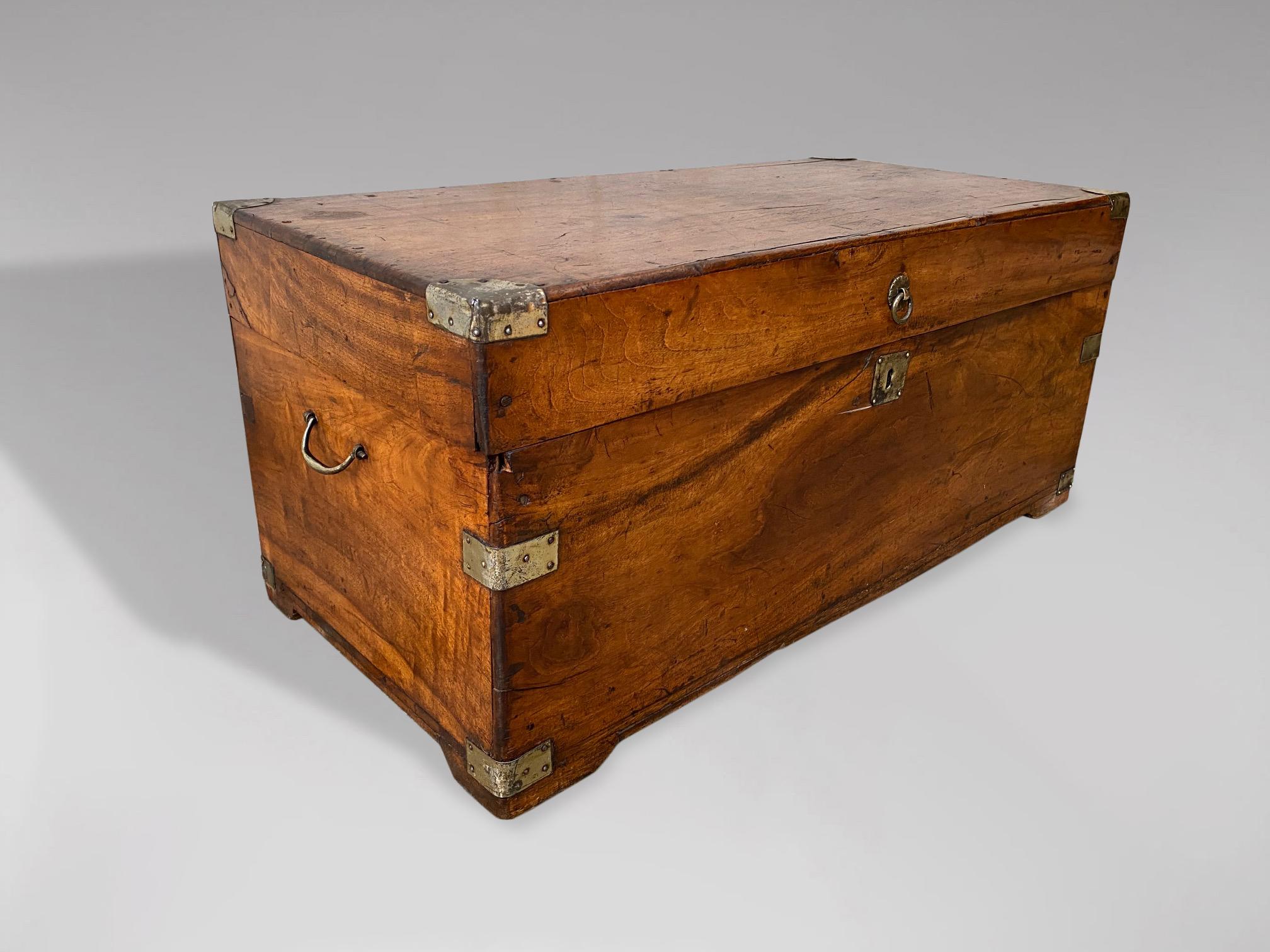 A small late 19th century camphor wood brass bound travelling chest or trunk with brass mounts and brass carrying handles. Warm rich colour and patina.

The dimensions are:
Height: 33cm (13.0in)
Width: 73cm (28.7in)
Depth: 36.5cm (14.4in)

This