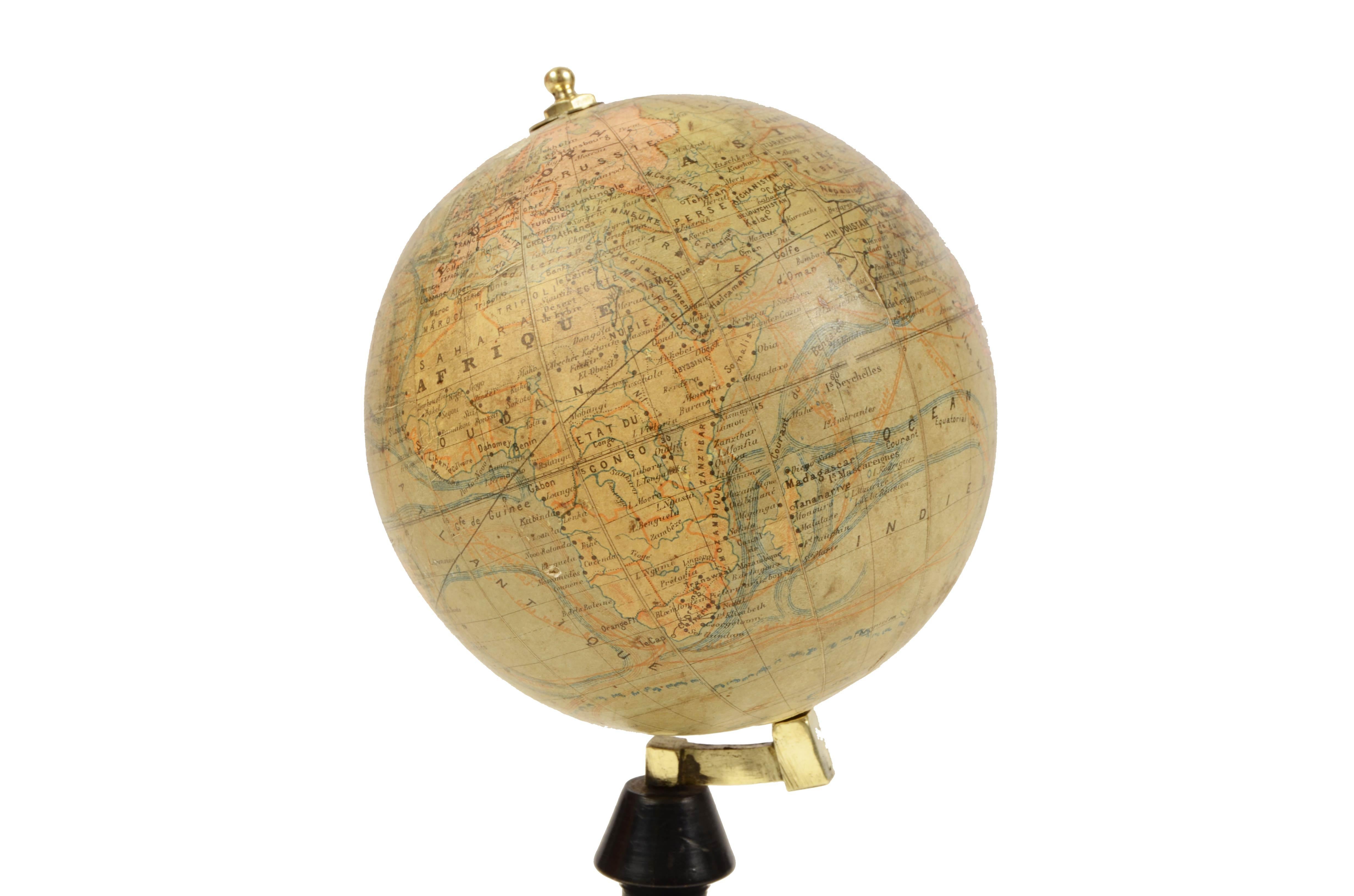 Small terrestrial published in the early 1870s by the French geographer J. Forest; there are territorial maps, ocean currents and the major trade routes of that period. 
Papier maché and plaster sphere covered by paper printed by an engraved copper