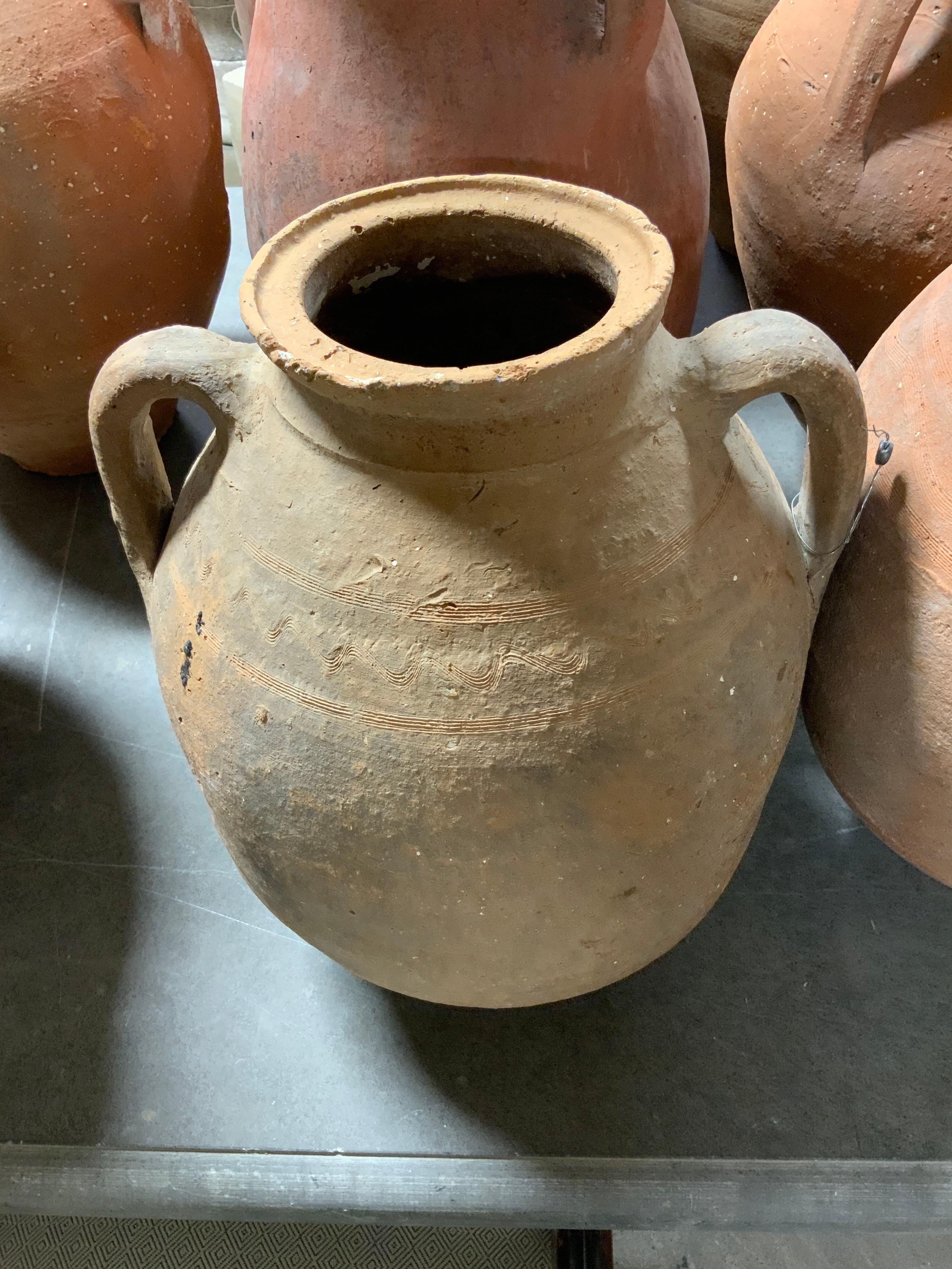 Gorgeous small terracotta water vessel, originates from Greece. Circa 1880s. Item is sold as individual. Dimensions outlined in image.