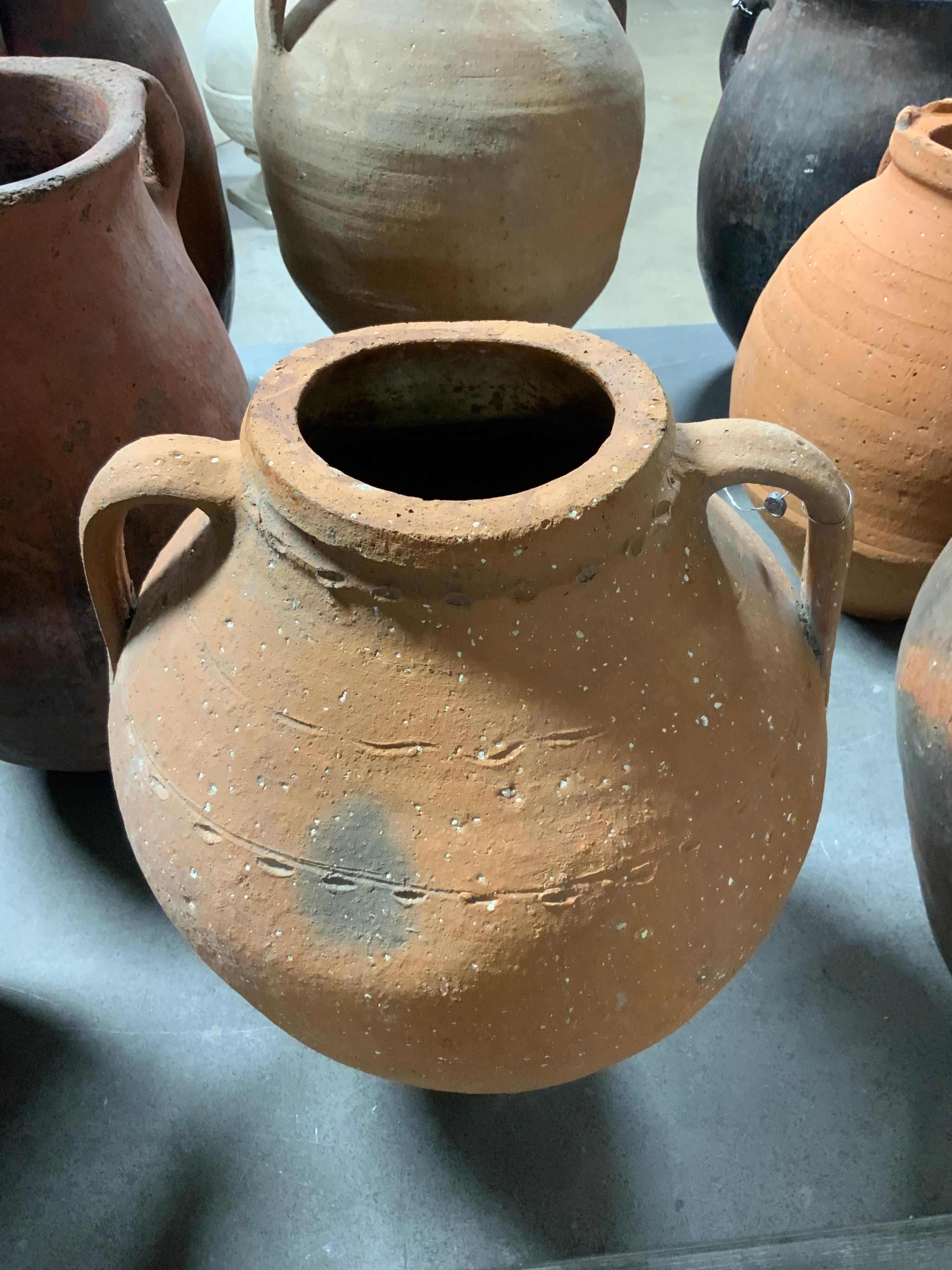 This small teracotta vessel dates back to the 1850s and originates from Greece. This item is perfect for outdoor garden space. Sold as single item.