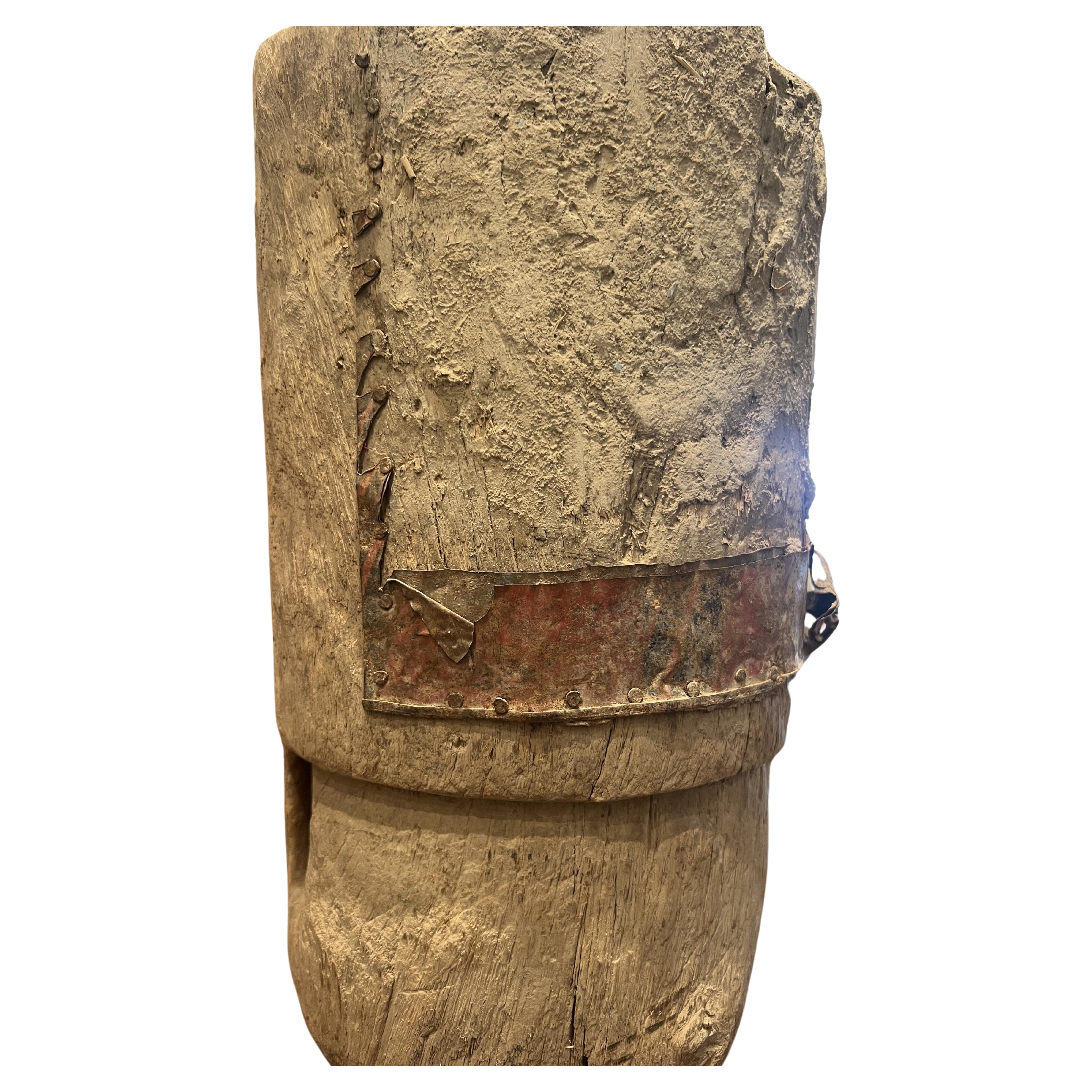 19th century small wooden/metal Mortar 


This exquisite mortar, dating back to the 19th century and originating from the region along the Yemen-Saudi border, is a captivating blend of functionality and artistry. Standing at an impressive height of