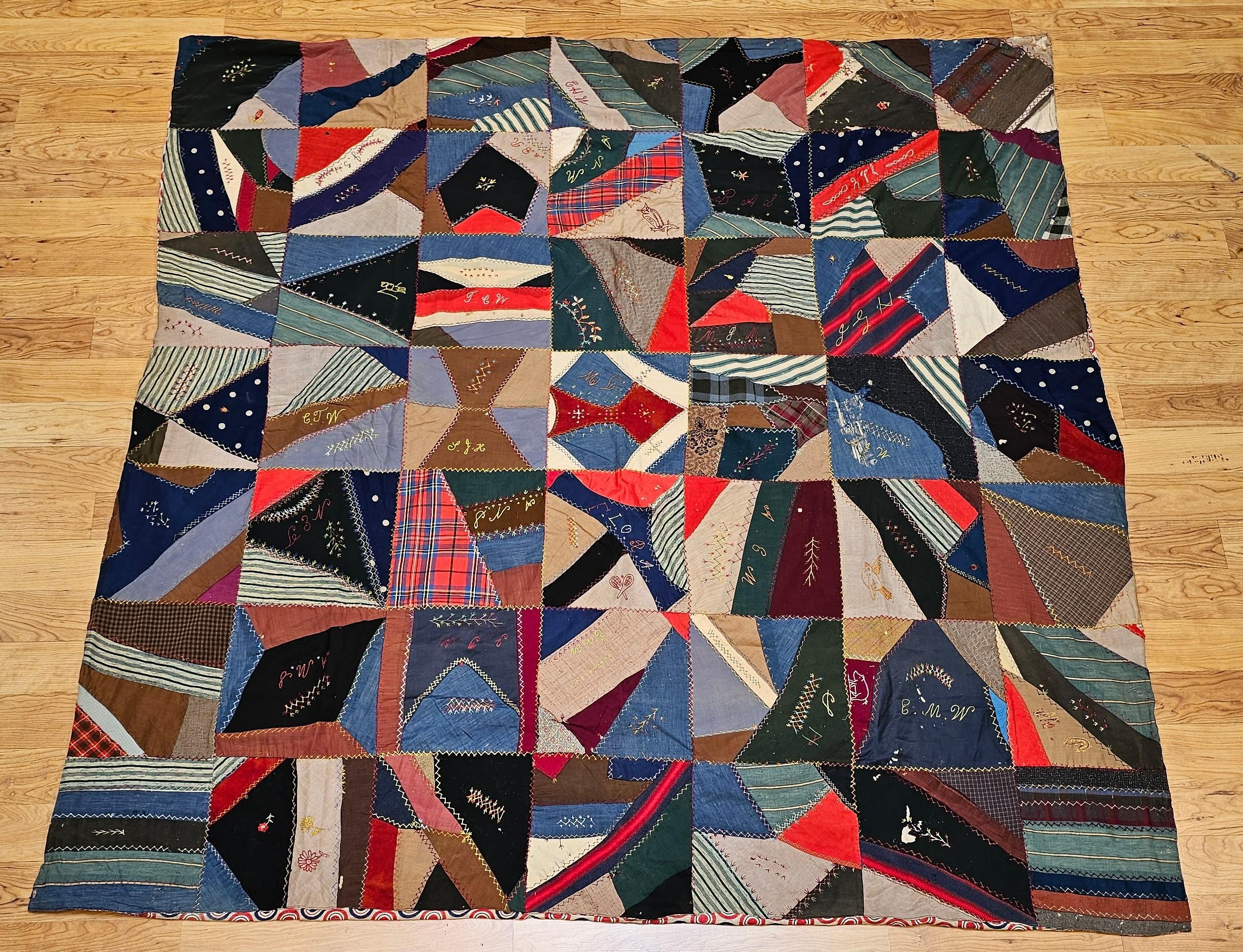 A remarkable example of American textile folk art, this late 19th-century Society Crazy Quilt is hand-pieced, hand-stitched, and richly embroidered. Constructed in a 7x7 block structure, each 11