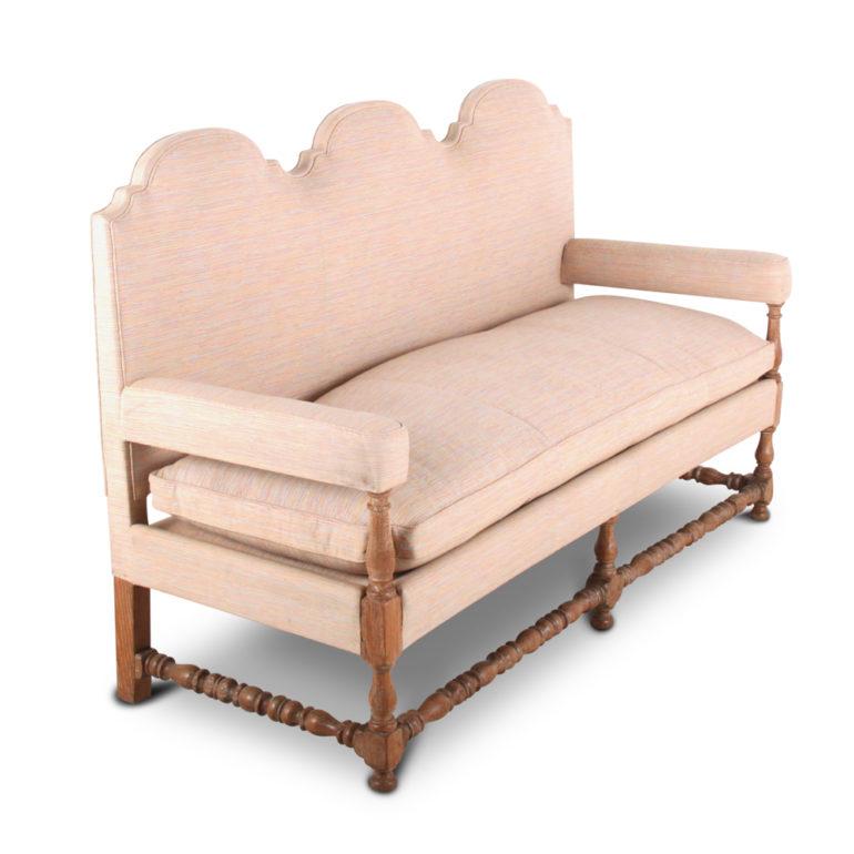 This French sofa or settee with turned oak legs and stretchers and a triple arched profile back dates to, circa 1900. It originates from the Villa La Pausa.

Villa La Pausa is a large detached villa in Roquebrune-Cap-Martin, in the Alpes-Maritimes