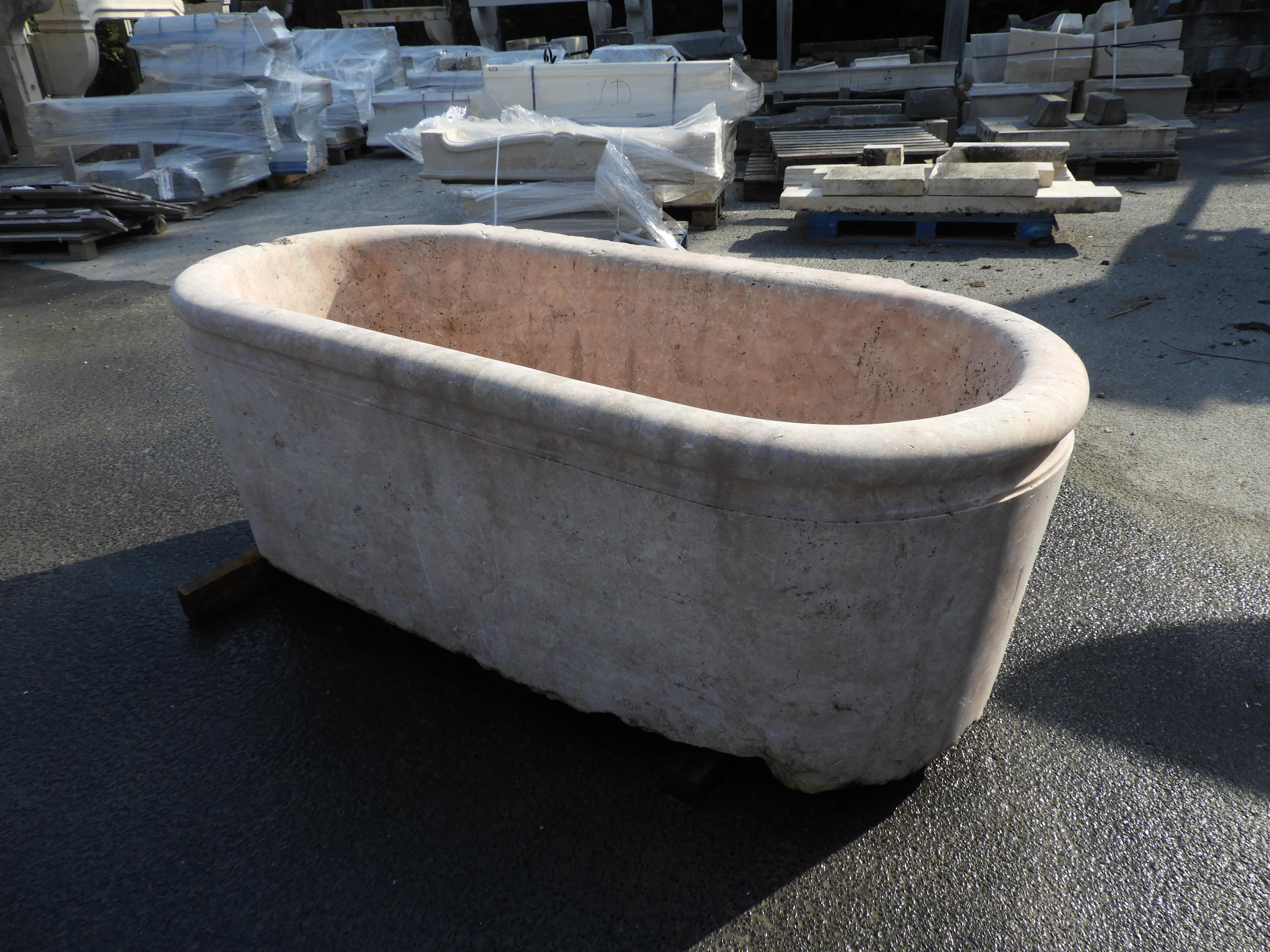 19th century solid marble bathtub in Rojo Alicante from the area of Alicante. Hand-carved out of 1 solid block of marble.