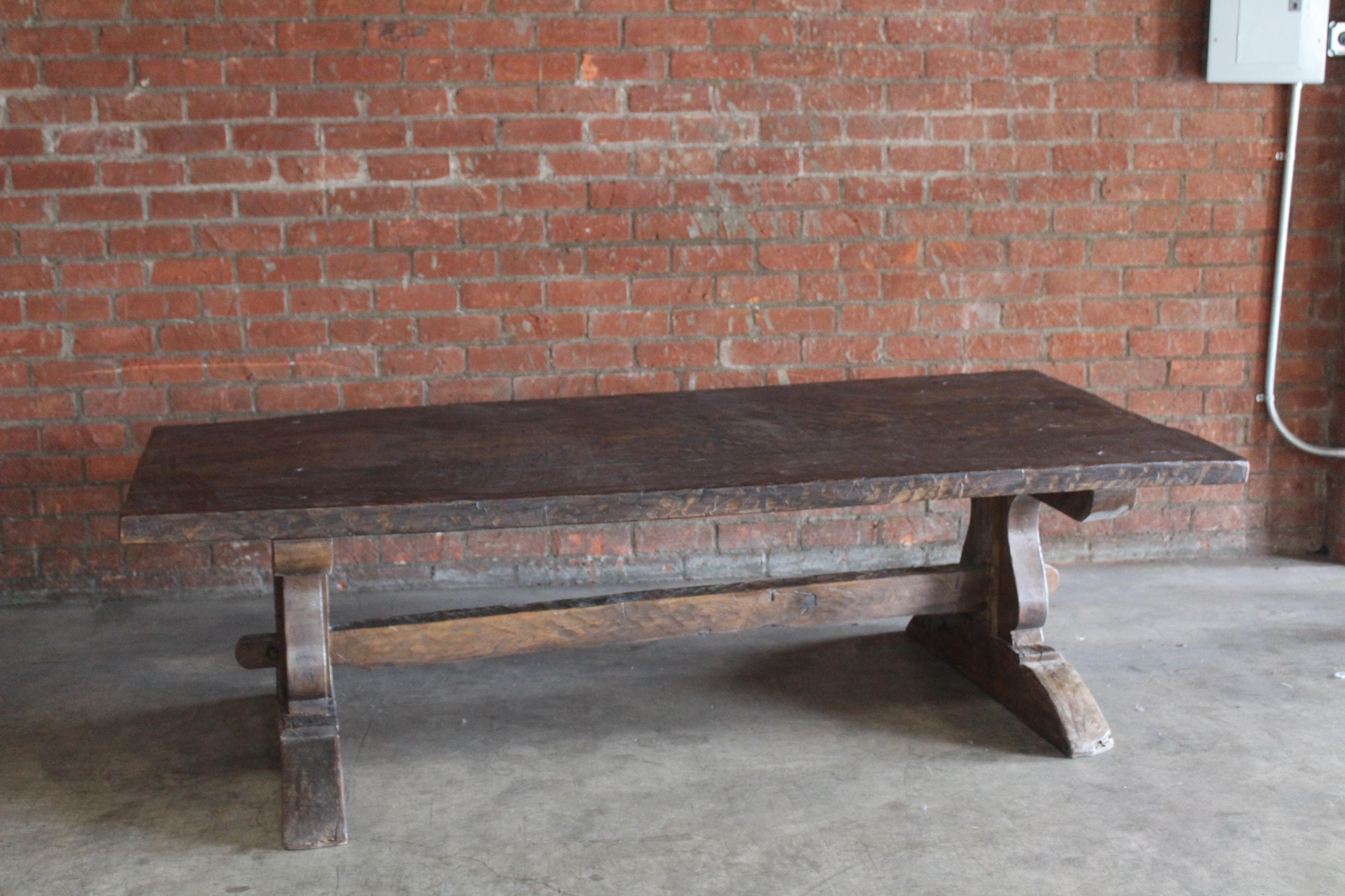 An antique 19th century worktable or dining table in solid oak, France. In good condition with age appropriate wear.