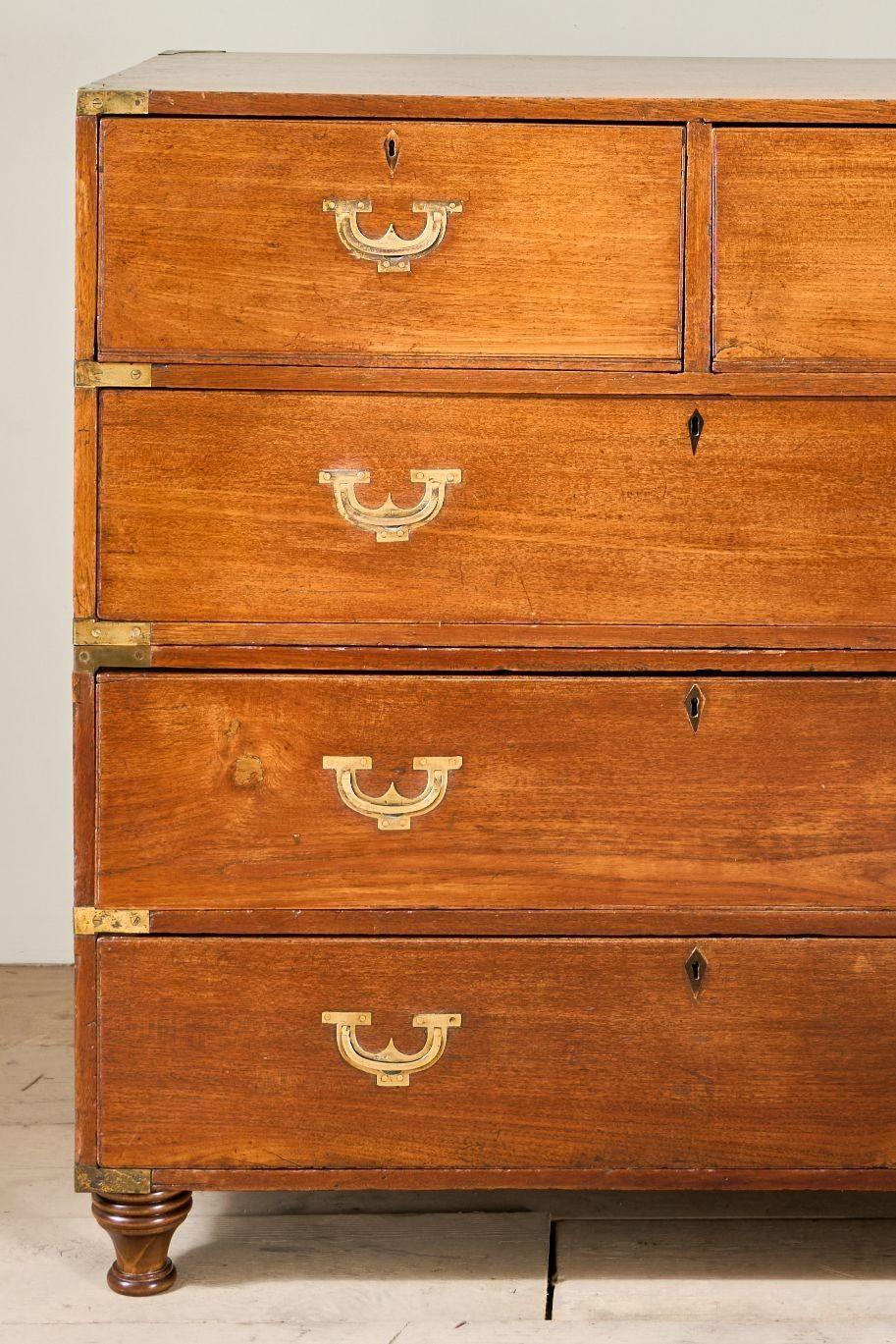 This is a particularly nice set of 19th century Anglo-Indian campaign drawers. This set is made from solid teak which has taken on a beautiful patina over the years and has the nicest handle design I have seen on this style of drawers. The handles