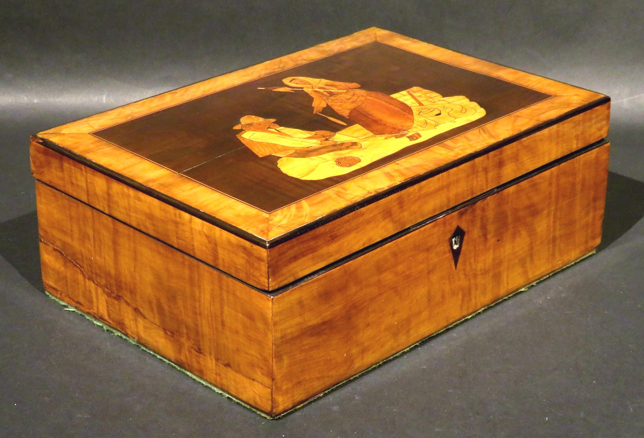 A charming 19th century Sorrento marquetry jewelry box or trinket box, the hinged lid illustrating a marquetry vignette depicting a young peasant couple - the young man shown seated while daydreaming, the young woman standing next to him spinning