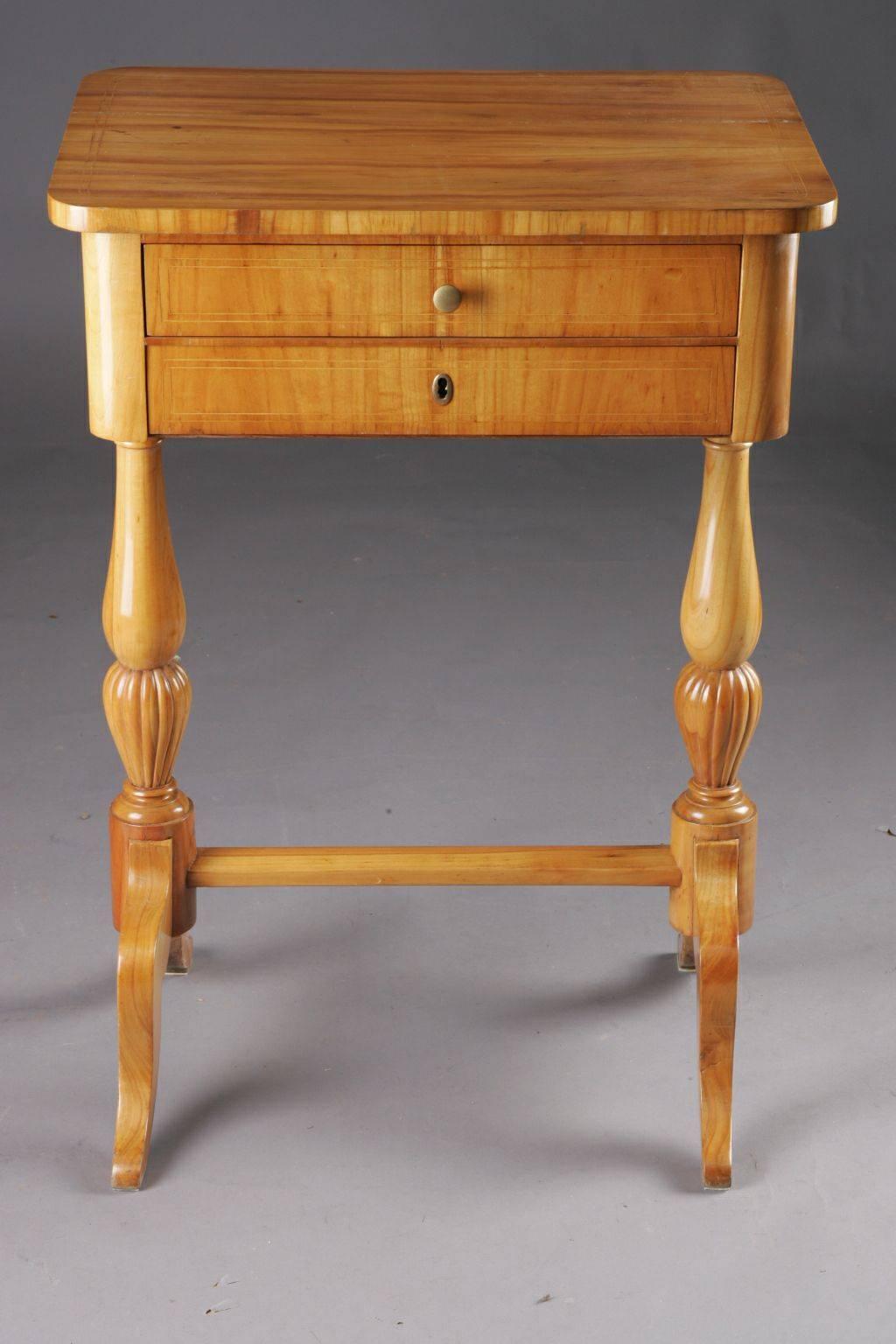 Cherrywood on solid softwood. Straight, two-wise frame box made of baluster-shaped columns, connected by turned column. Four-sided tabletop in compartments for sewing utensils.

(G-24).