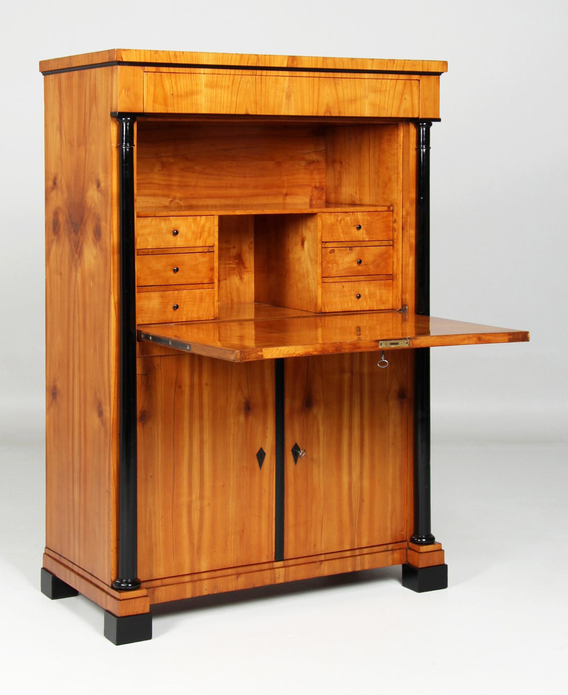 Plain Biedermeier Secretaire

South-West Germany
Cherry
Biedermeier circa 1830

Dimensions: H x W x D: 149 x 101 x 52 cm

Description:
Secretary standing on blackened block feet with two doors at the bottom, a writing flap above and a handleless