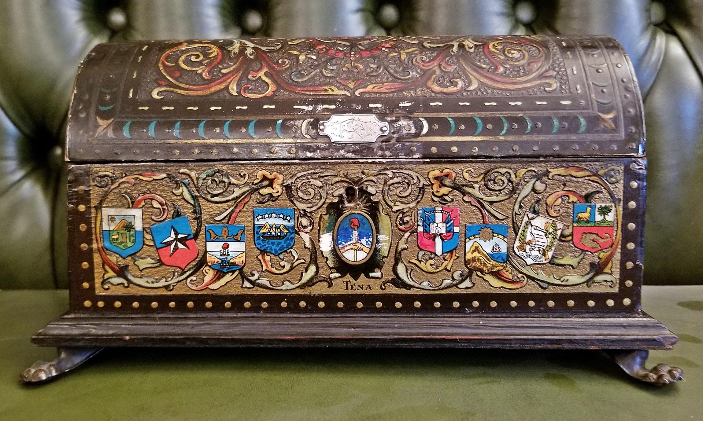 Very unusual and rare 19th century trinket box from Toledo, Spain, with a Central and South American influence.

From circa 1890.

The box is in the shape of a little treasure chest and heavily Spanish influenced.

The front has the name