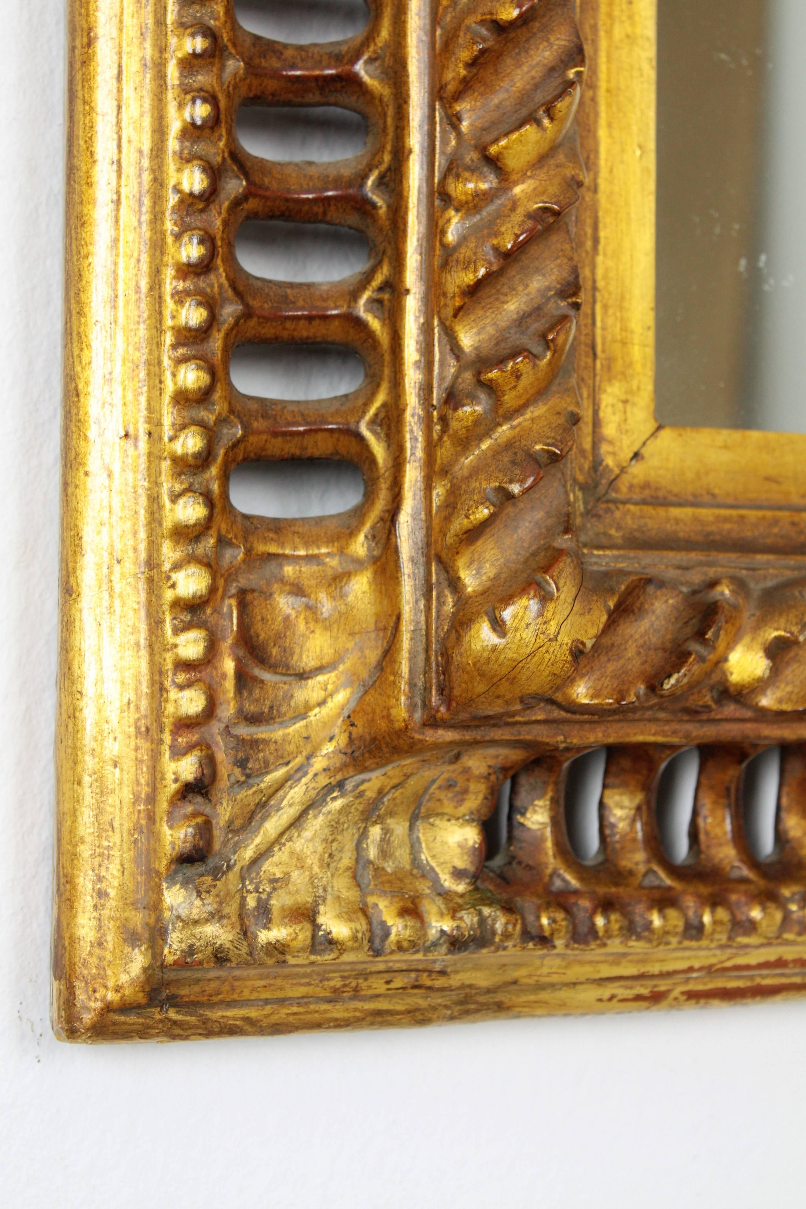 Gold Leaf 19th Century Spanish Baroque Carved Giltwood Mirror with Reticulated Frame