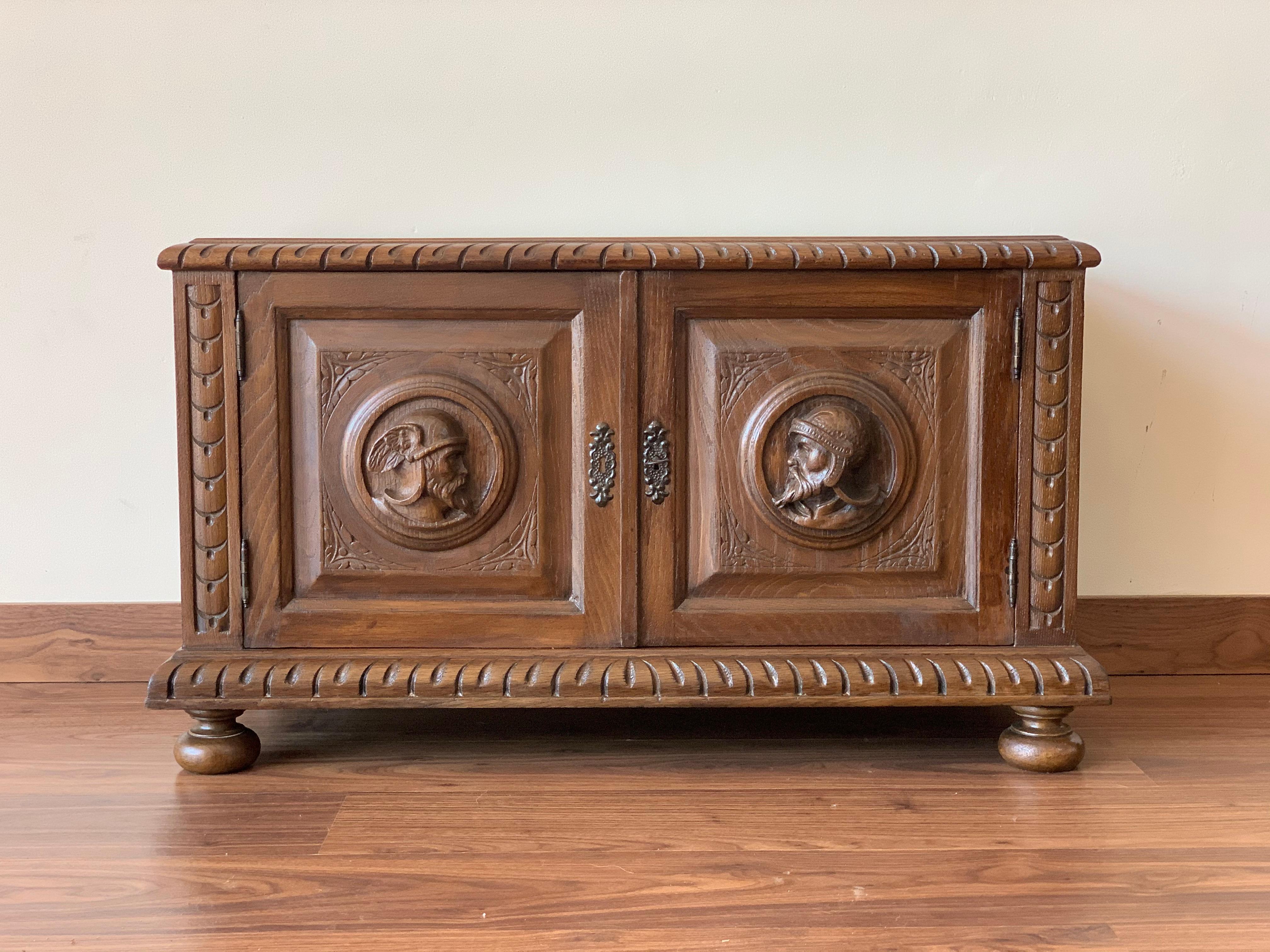 Nice 19th century chest in brown chestnut. Hand carved facade panel with heads decorations. Plinth with brace decorations, dovetail assembly with wrought iron wardware.
Add a real show stopper to your interior with this extremely Spanish chest or