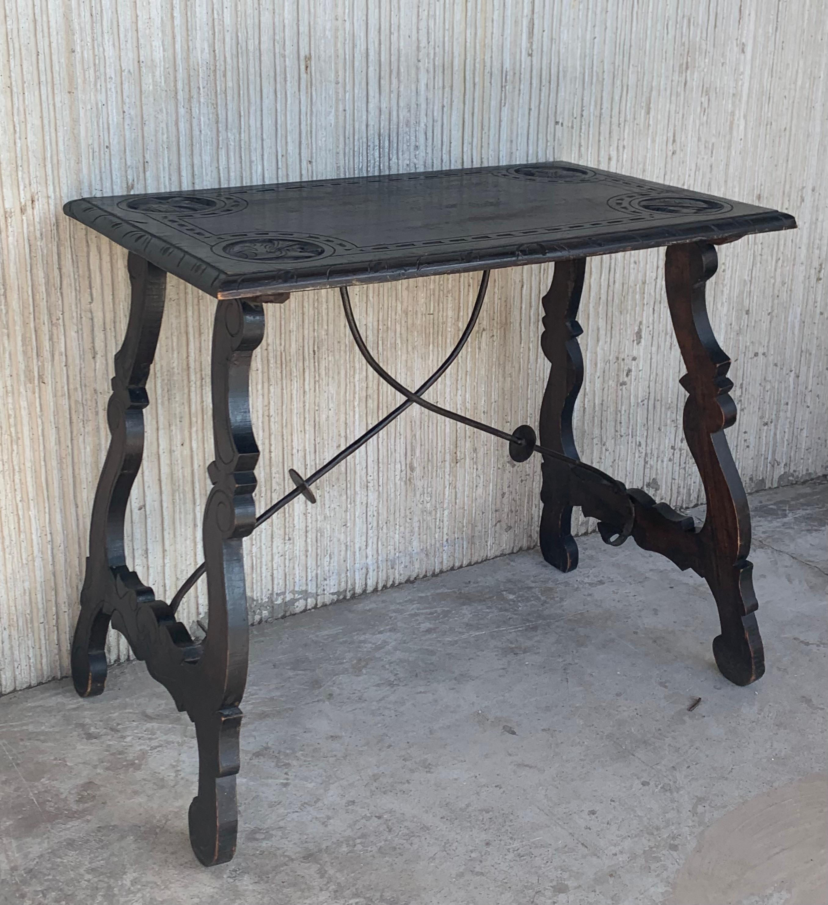 19th century Spanish Baroque side table with carved top and carved edgeds
Beautiful carved lyre legs and iron stretcher.