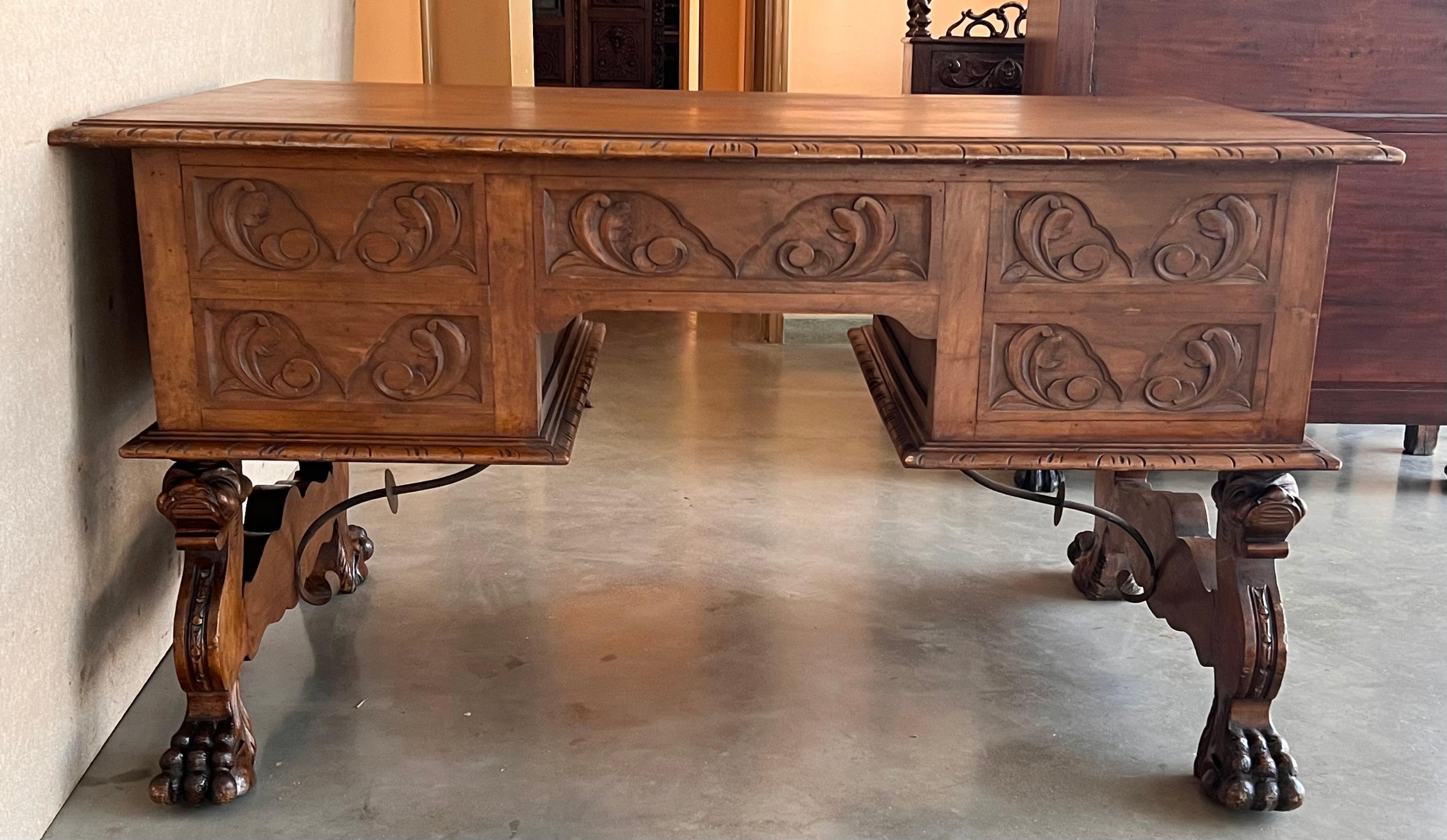 Handsome oak library piece that can be used as a desk or Work table. Made of oak having carved gadrooned edges. A stretcher made of iron. Carved on all sides and five drawers ox bow ends, 19th century.
Workable locks and keys.
