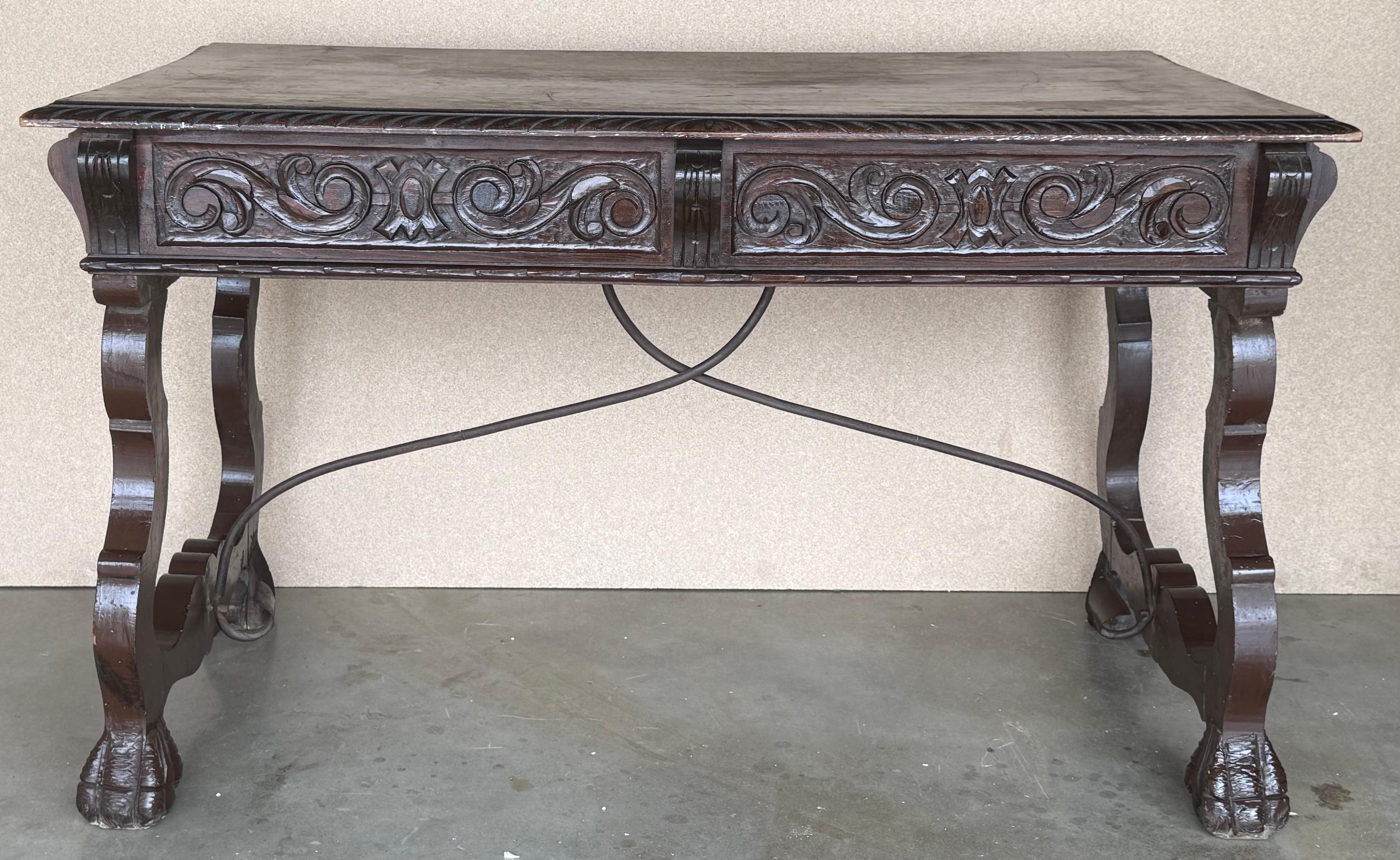 Handsome oak library piece that can be used as a desk or Work table. Made of oak having carved gadrooned edges.  Carved on all sides and five drawers ox bow ends, 19th century.
Workable locks and keys.

Height from the floor to the bottom drawer