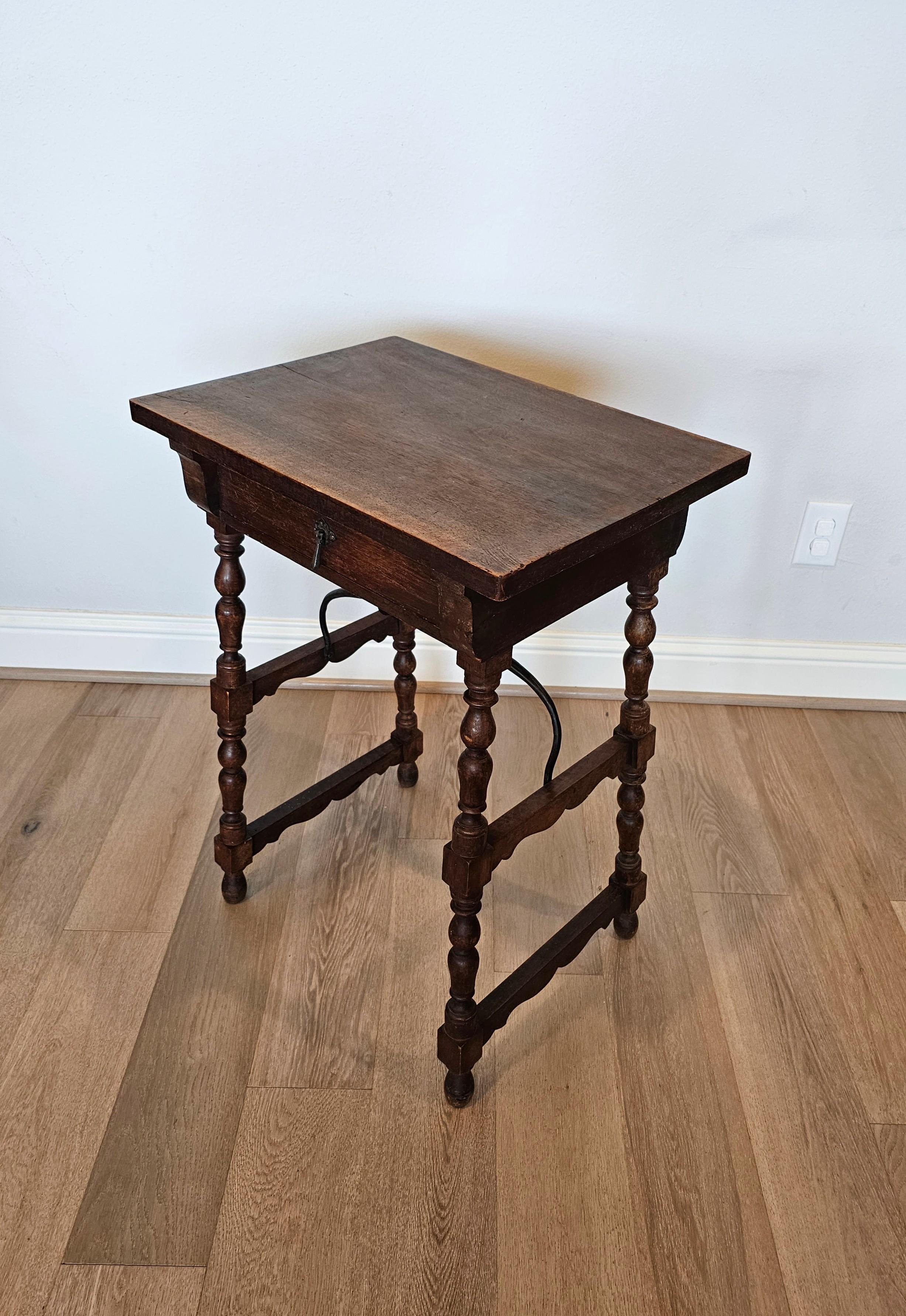 A charming rustic antique Spanish walnut work / side table with nicely aged patina. 

Born in Spain, circa 1860s, hand-crafted of warm rich solid walnut wood, exceptionally executed in old world European Baroque style, having a rectangular single
