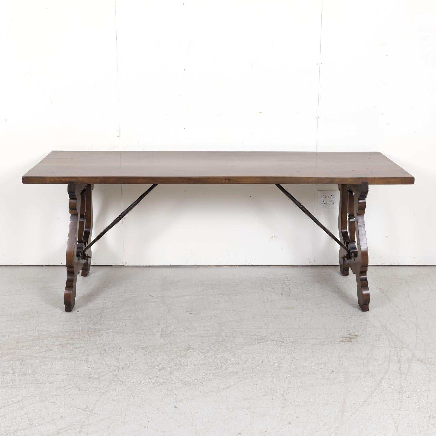 Hand-Carved 19th Century Spanish Baroque Style Walnut Trestle Dining Table with Iron Stretch