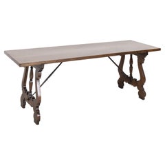 19th Century Spanish Baroque Style Walnut Trestle Dining Table with Iron Stretch