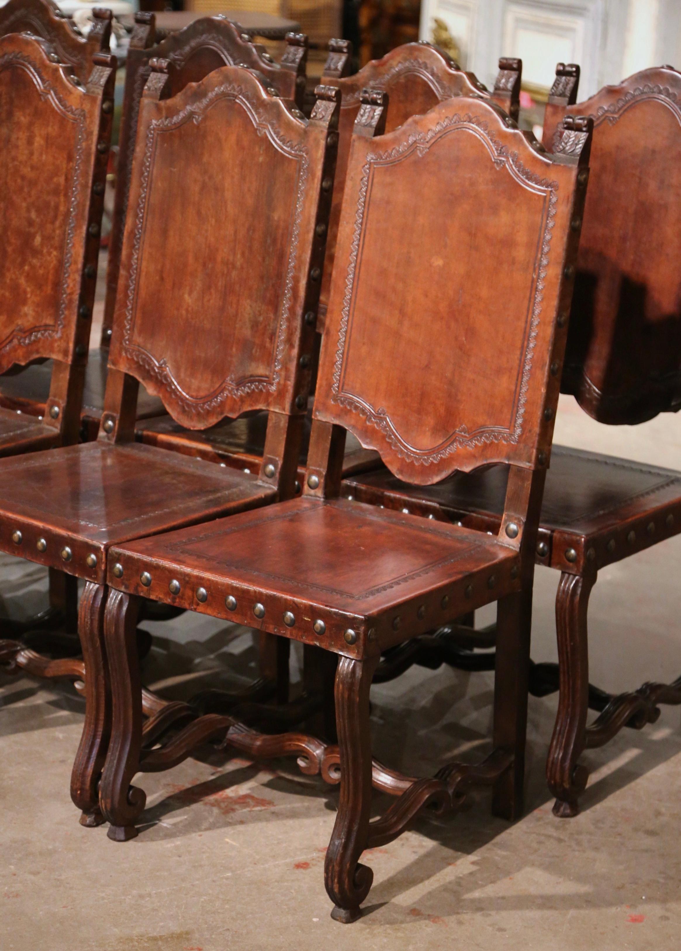 Patinated  19th Century Spanish Carved Walnut Chairs with Embossed Leather, Set of Eight