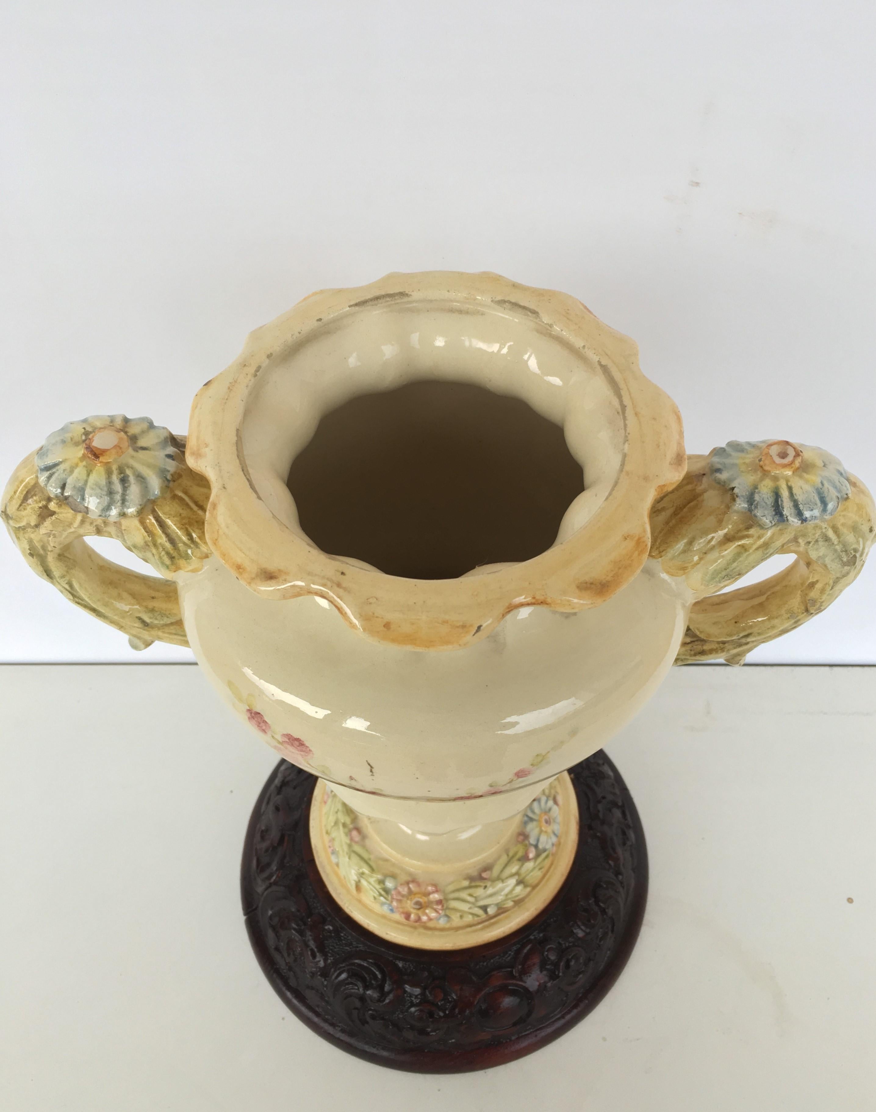 19th Spanish ceramic floral urn with two handles and carved wood base

Enameled and gilded vase ceramic Peyró Antonio Valencia, circa 1950 signed and stamped 