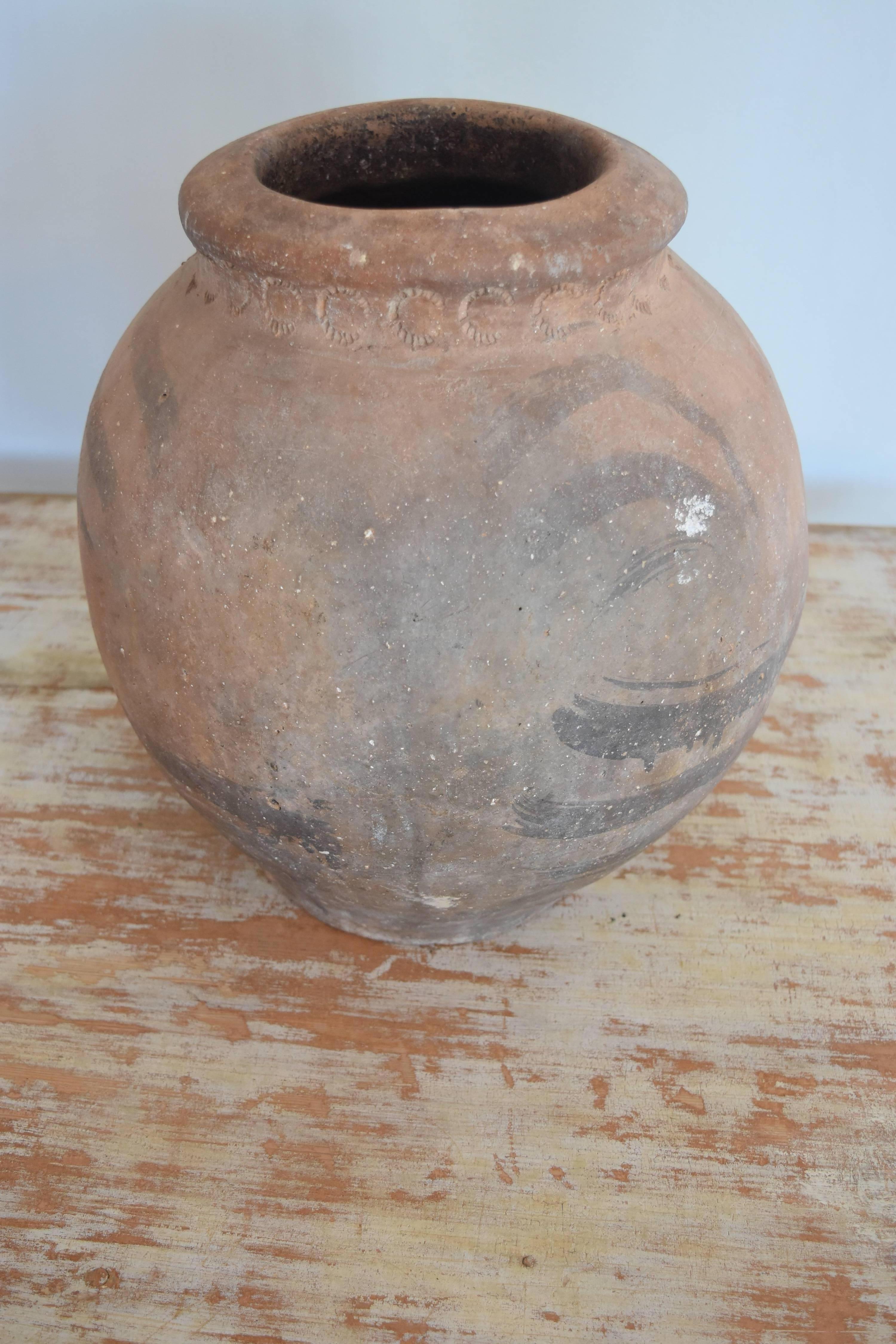 This ceramic Jar has wonderful markings and is in excellent condition. It originates from the mountains of Andalusia, Spain and is from the 1800s. The mouth of the jar is 8
