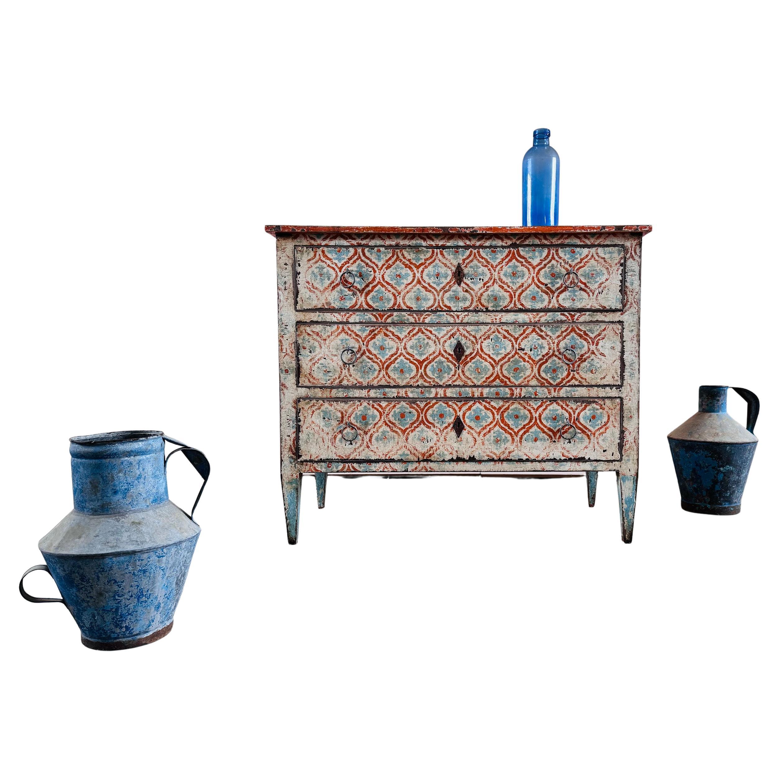 This late 19th Century chest of drawers has been expertly hand-painted, rather than stencilled,  by our friend Jose in Catalonia.

Beautiful colours / patina and geometric design.

Structurally in good condition with some signs of old worm which we