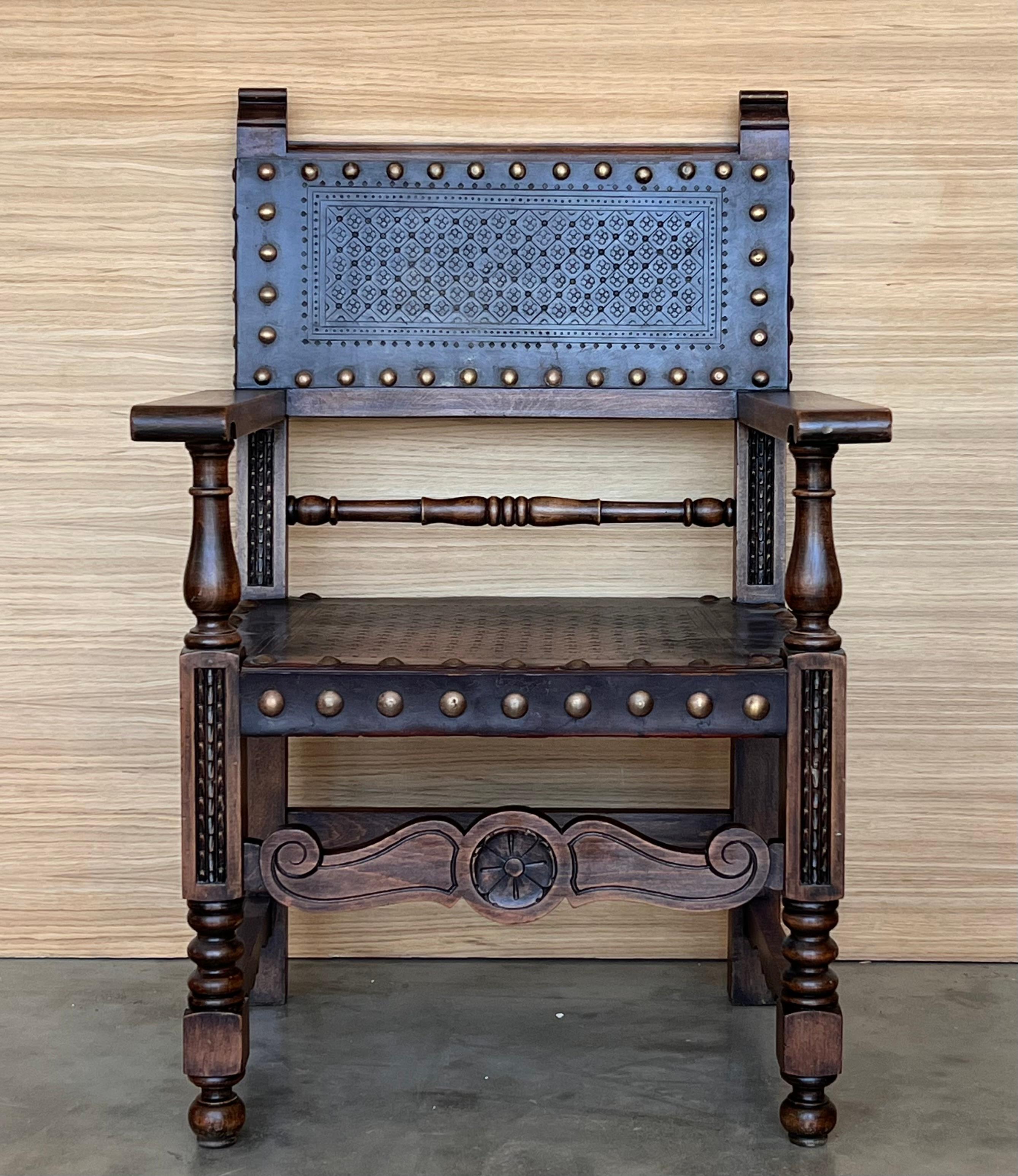 19th century Spanish colonial altar armchairs with wood seat with ornamental carved on the back and beautiful legs and armchairs. There are a very resistant and heavy armchairs.

Measures: Height to arms  27.16in