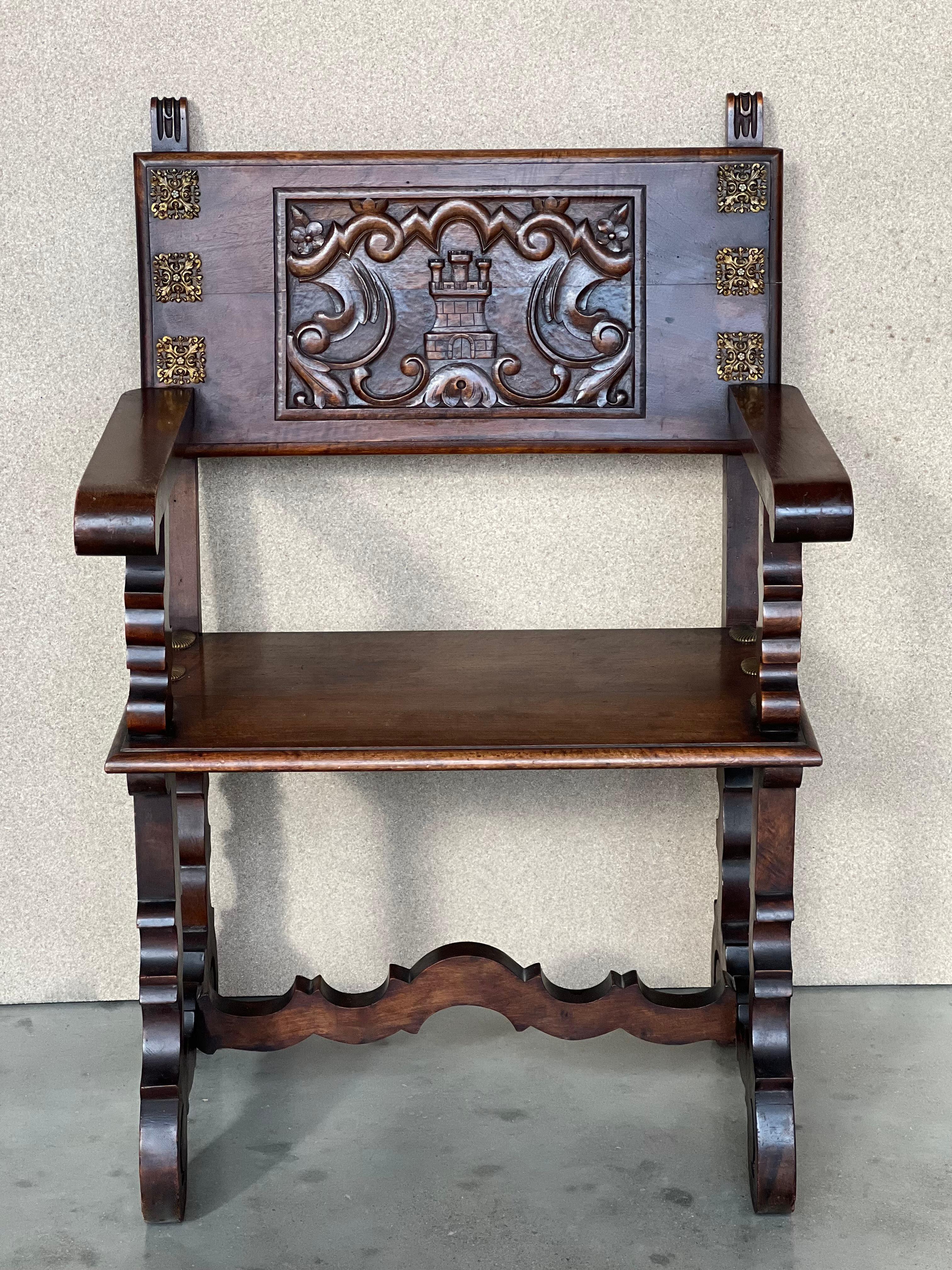 19th century walnut Spanish colonial altar armchairs with wood back with ornamental carved and wood seat. The unusual lyre legs complete this exceptional pair of armchairs
Measures: Height to arms 27.95 in.