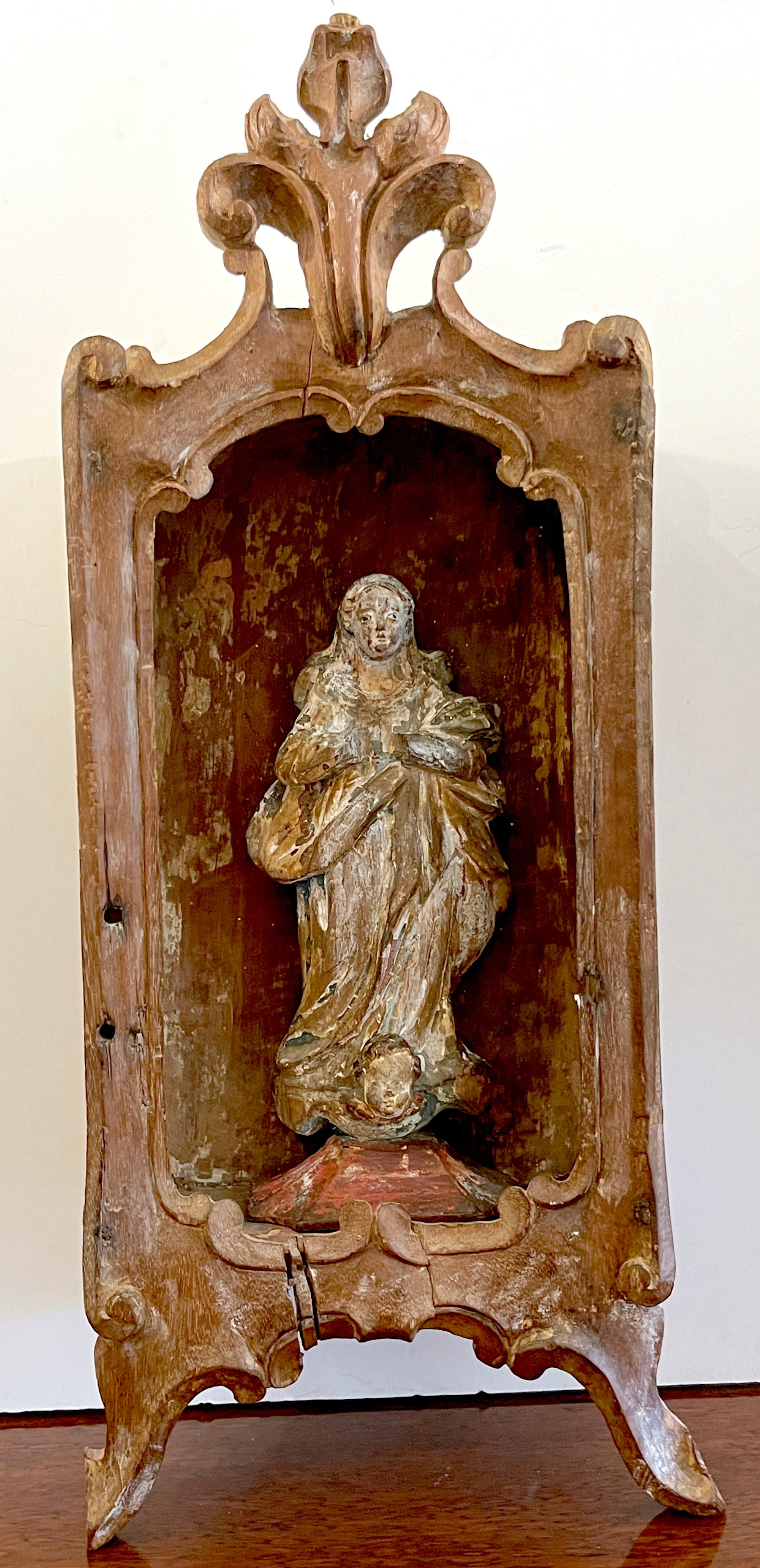 19th Century Spanish Colonial Santos wall hanging shrine of the Virgin Mary 
South America, Mid-19th Century or Older
Consisting of two pieces, the distressed (structurally sound) tabernacle/ shrine with pierced crest top, and two front legs,
